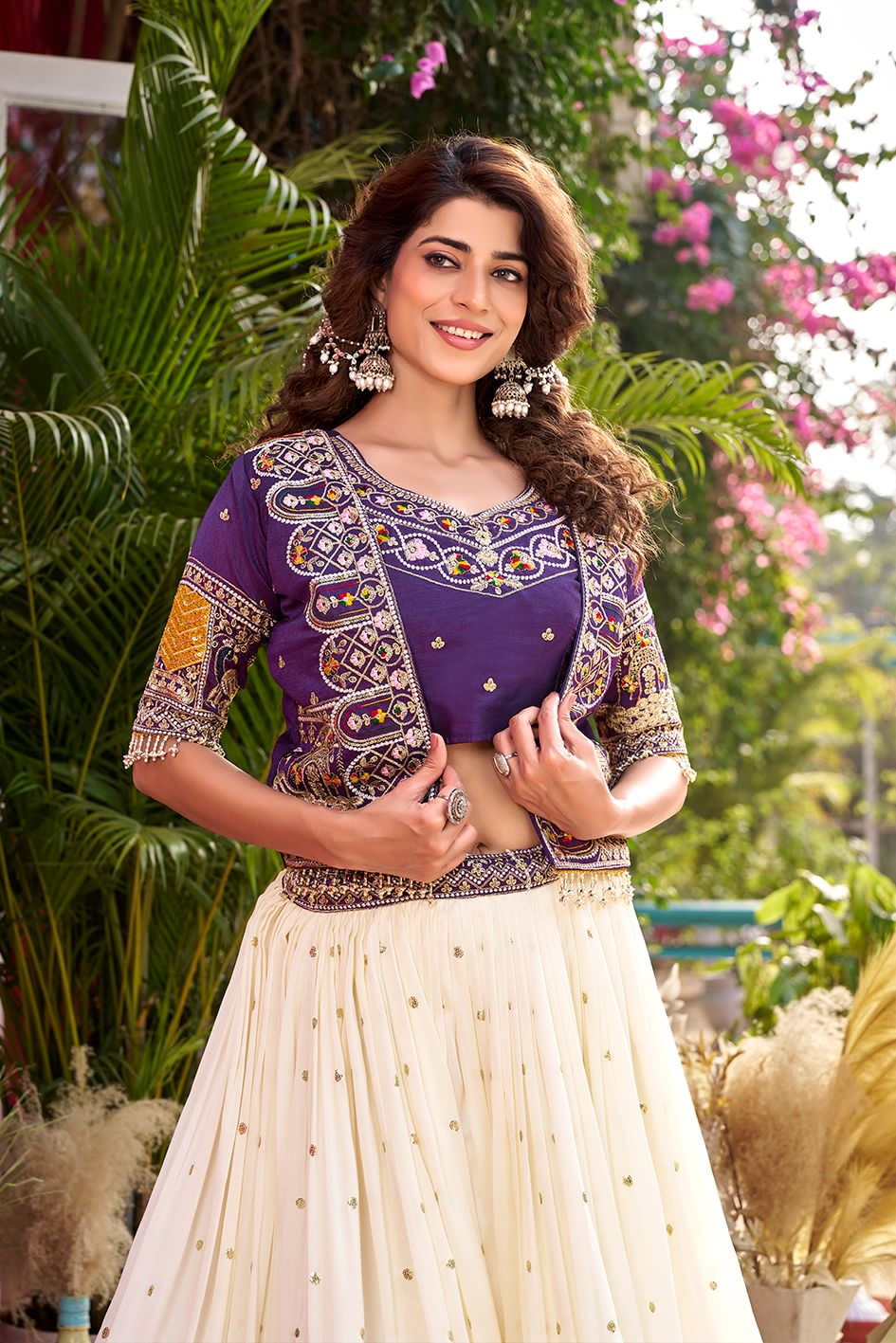 traditional outfit with white skirt and purple top 