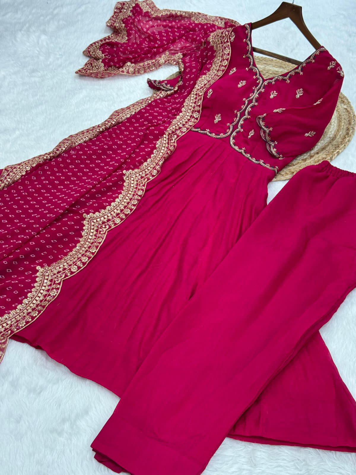 Pink traditional outfit with intricate embroidery work