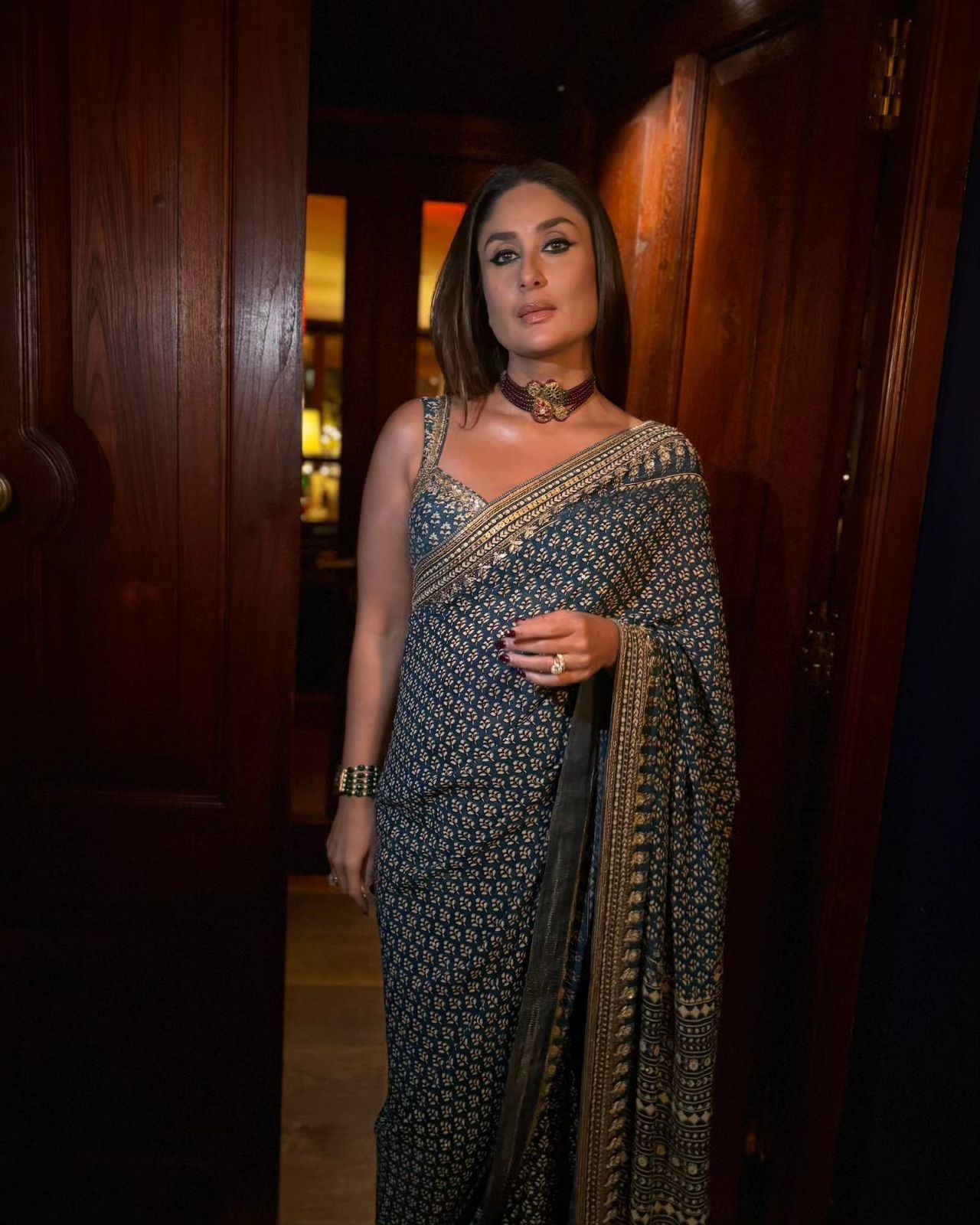 Woman in a blue patterned saree