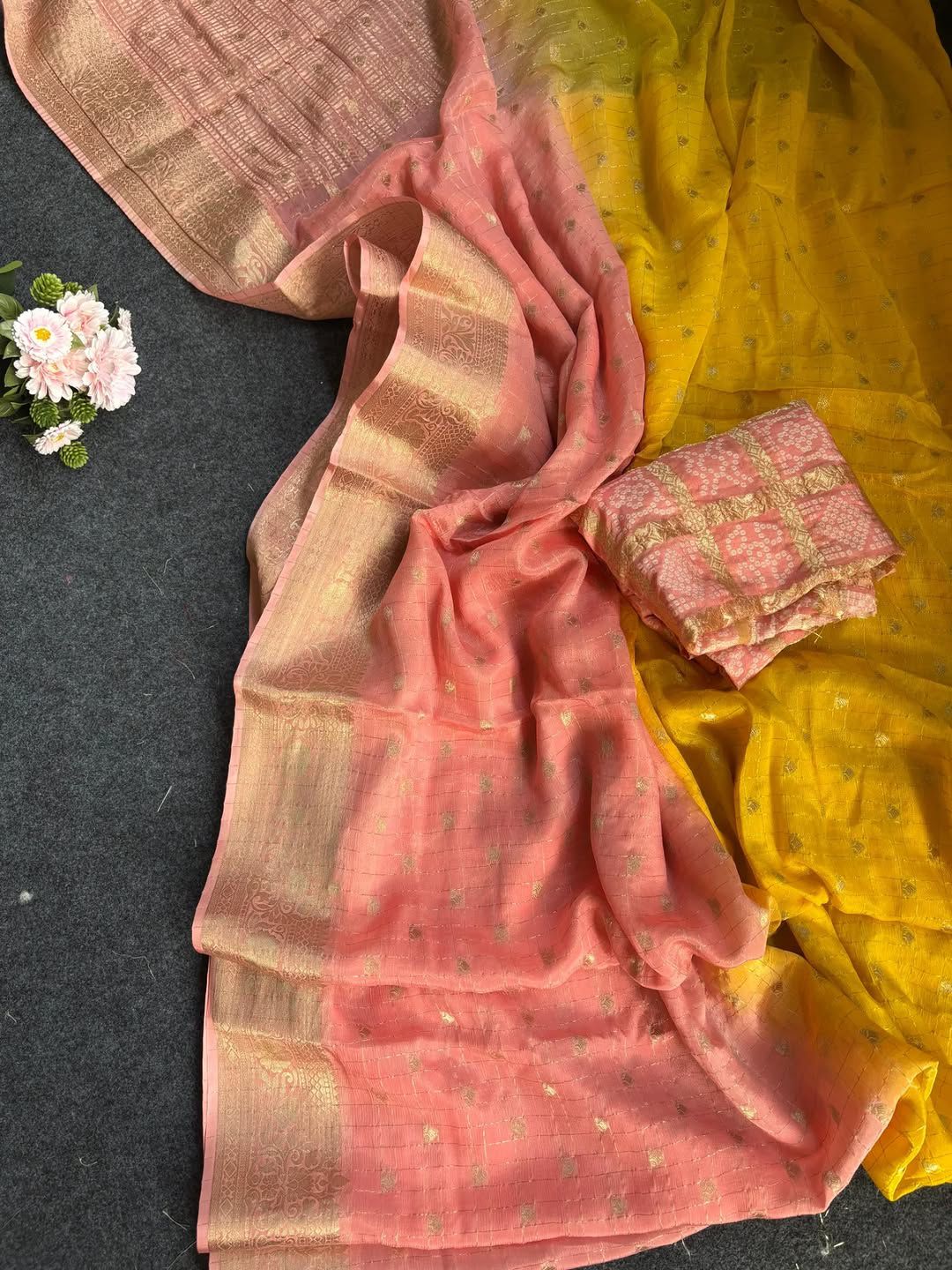 Peach fabric and floral decoration on a dark background