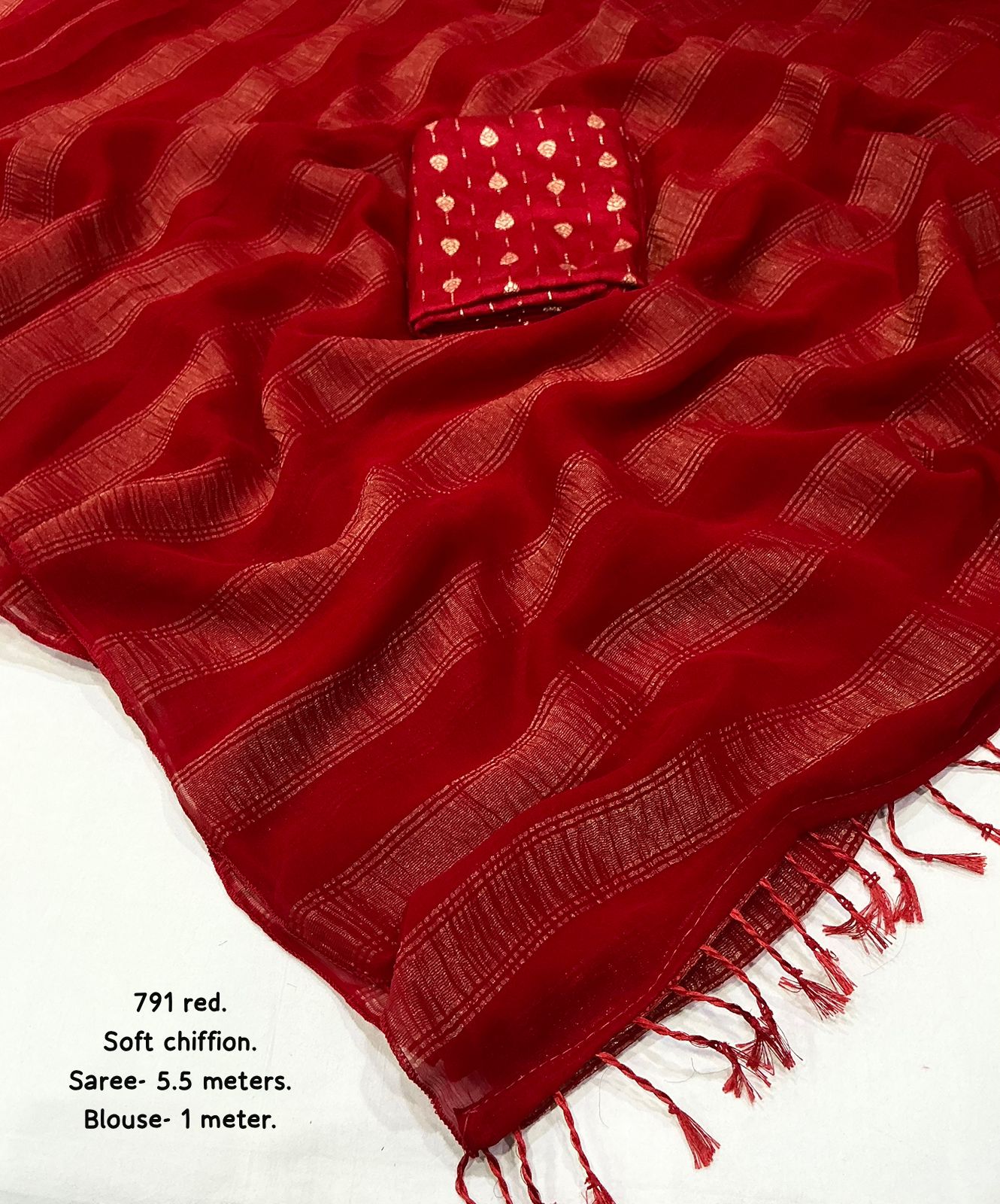 Red saree with a patterned box on a white background
