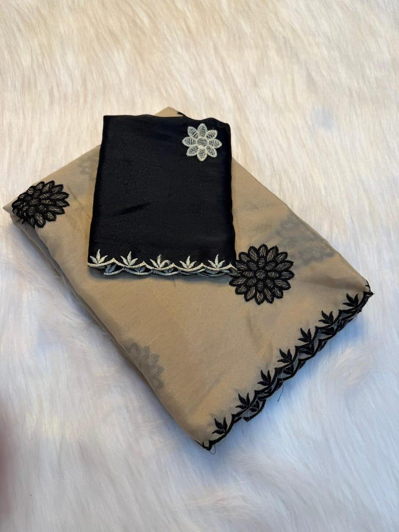 beige fabric with floral embroidery on a textured surface