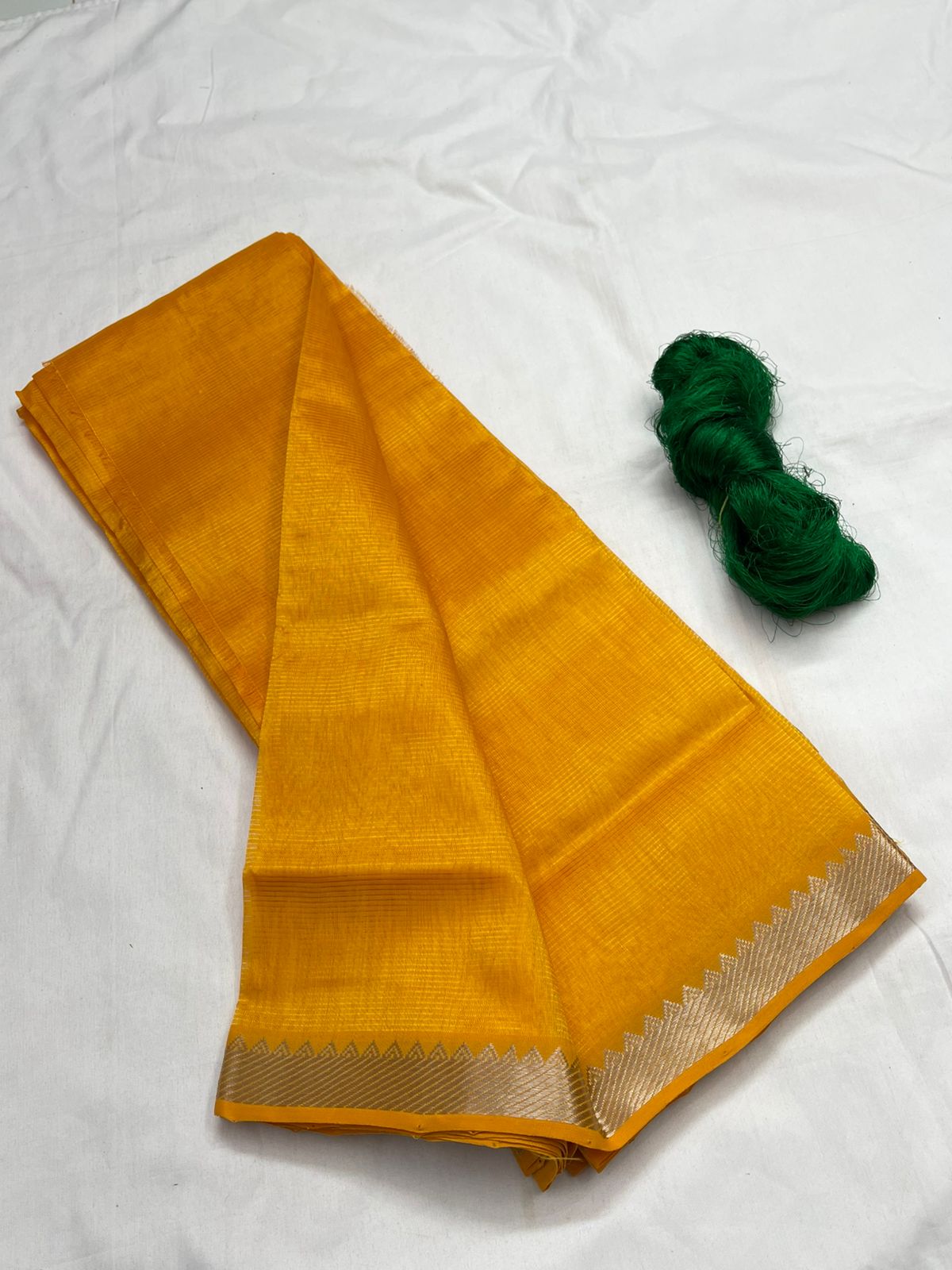 A yellow Mangalagiri Handloom pattu saree