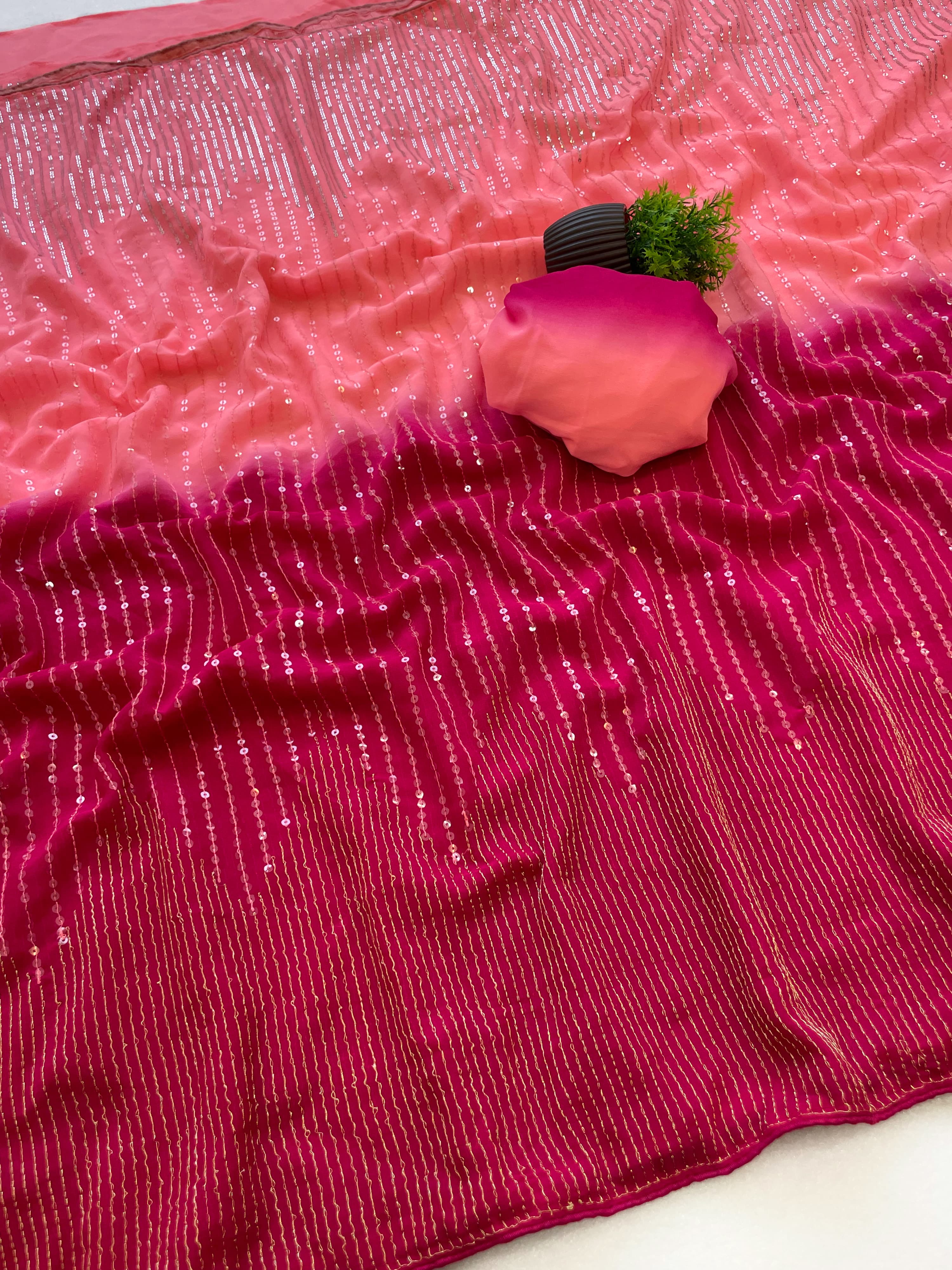 Pink fabric with a textured pattern on a white surface