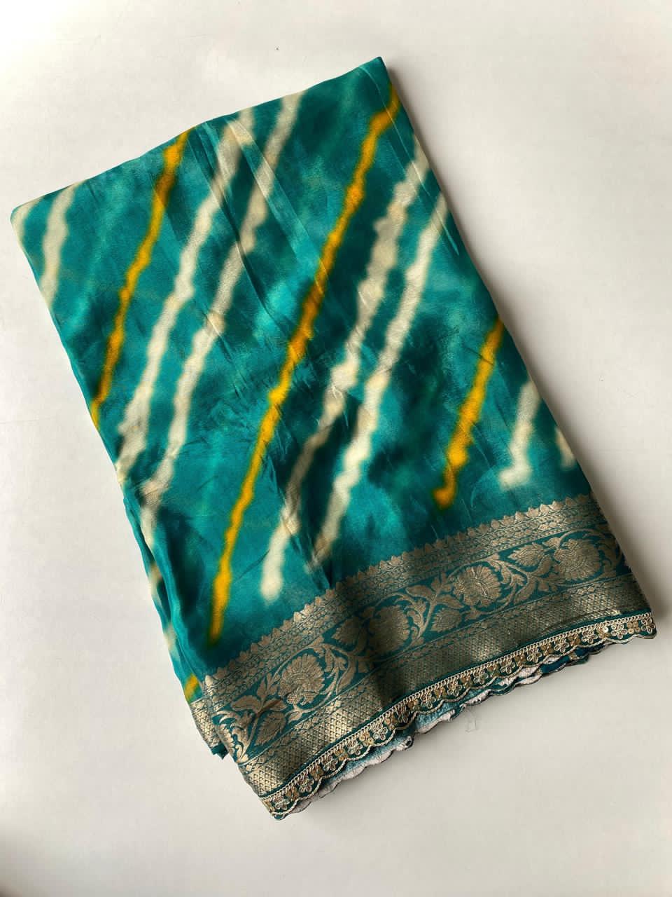 Rama green fabric with a decorative border on a white background