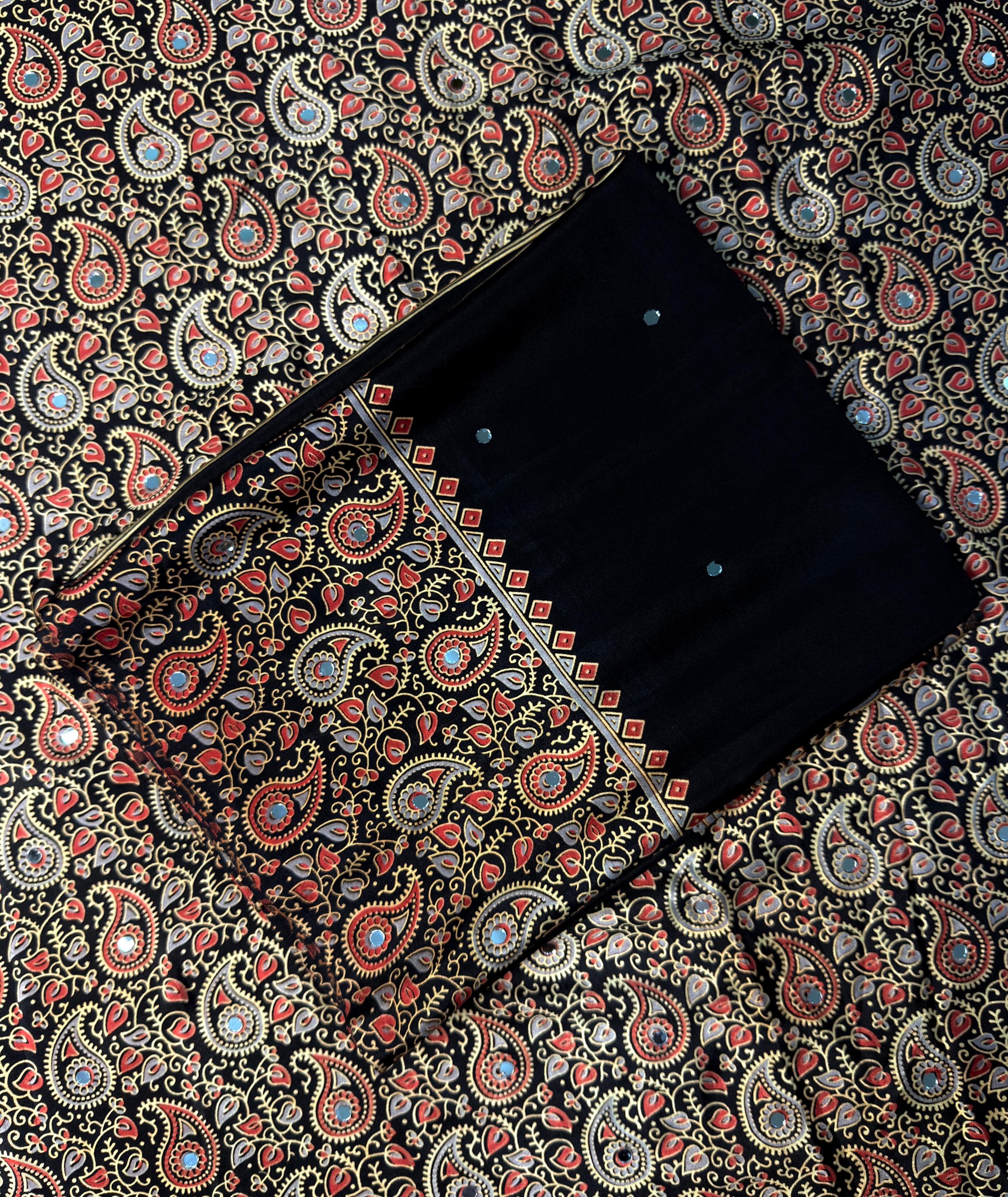 Black sareeon a patterned fabric background
