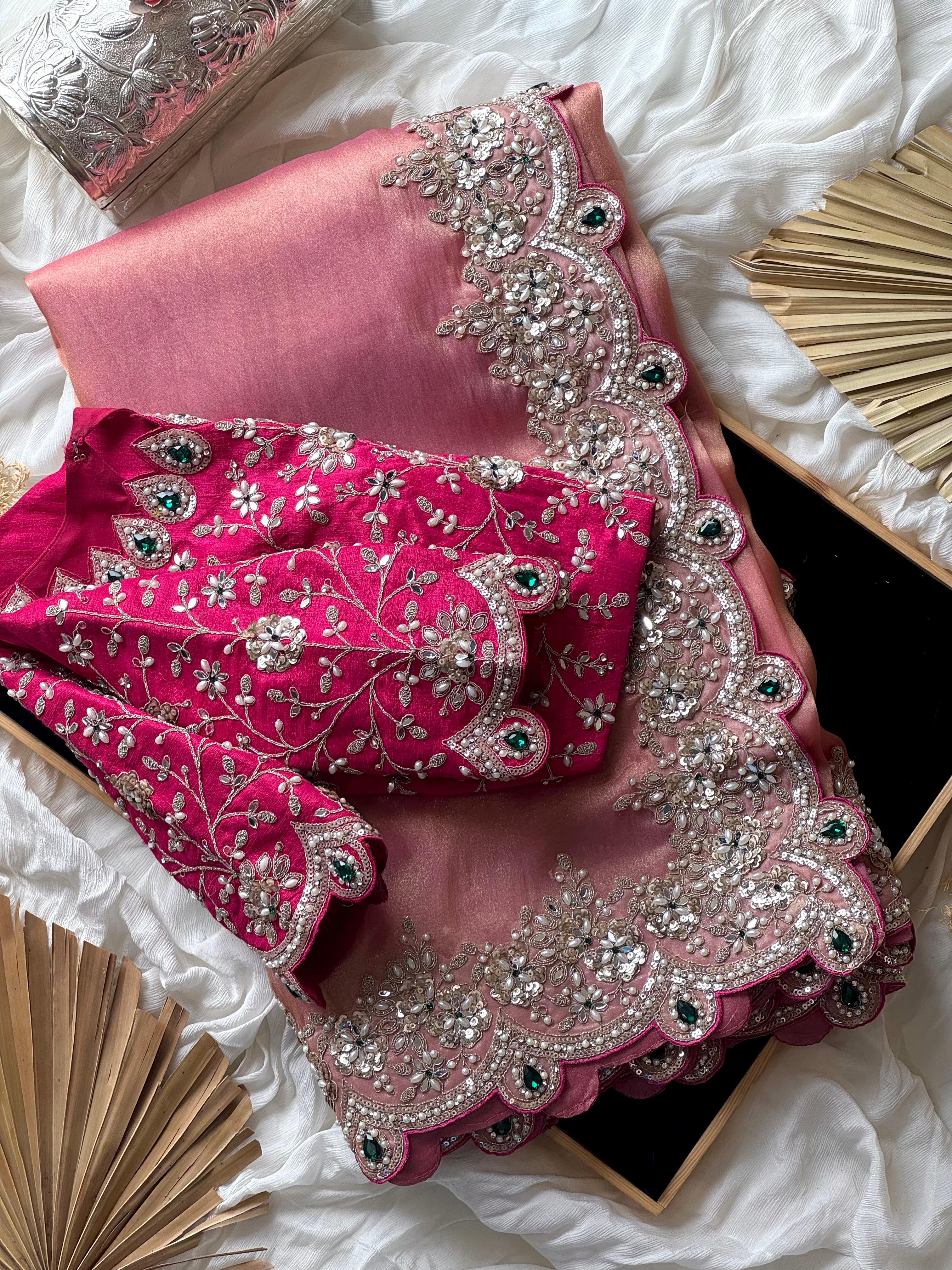 Onion Pink embroidered fabric with silver and green details on a white background