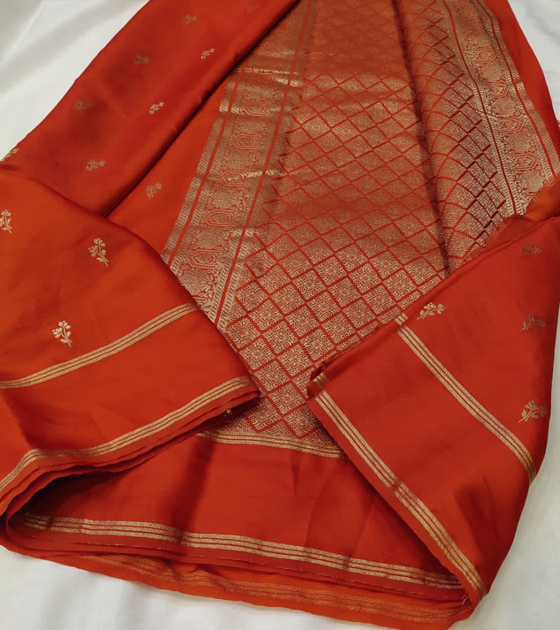 Orange saree with floral patterns 