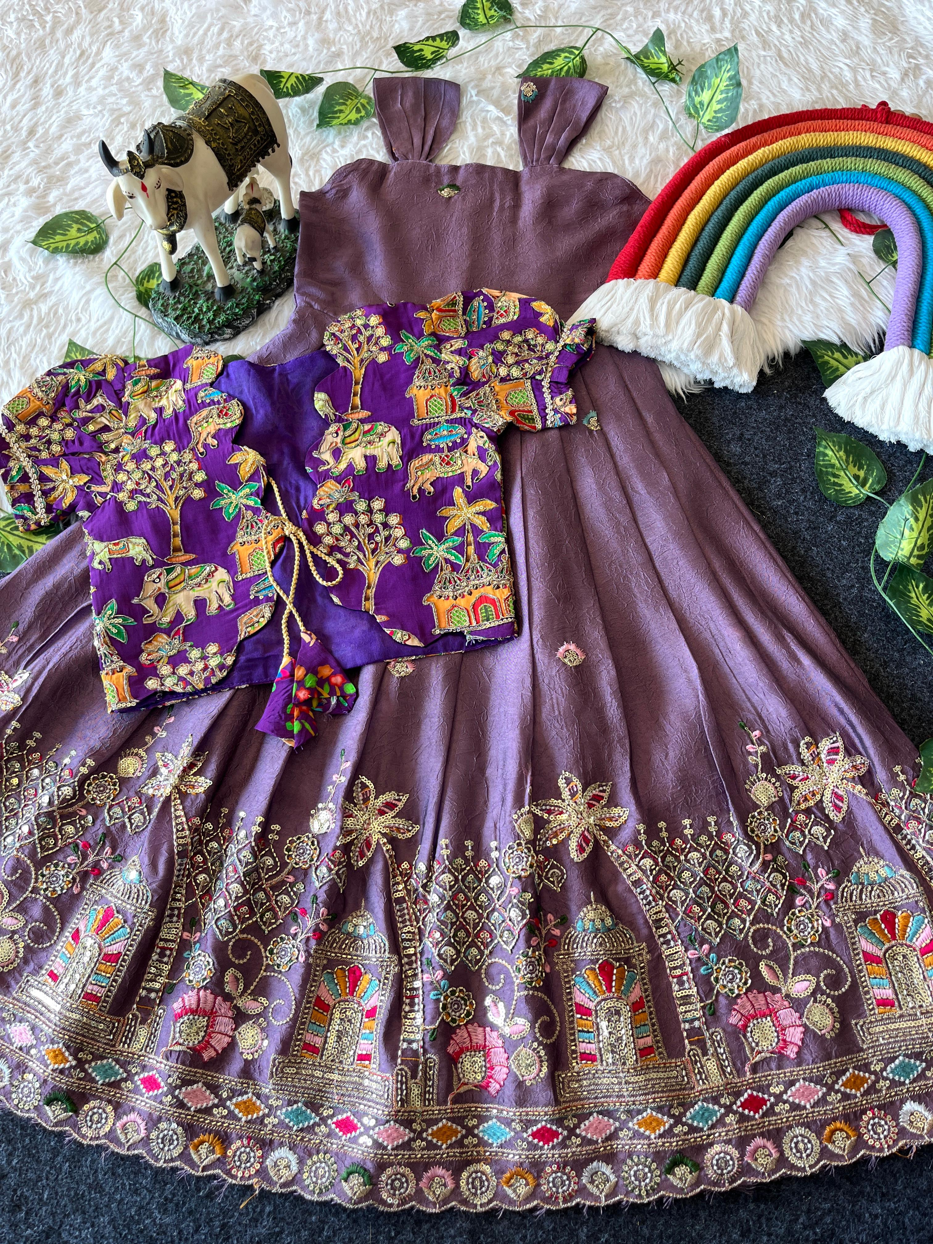 Decorative outfit with embroiderey lavender dress, colorful blouse, and rainbow umbrella on a textured surface.