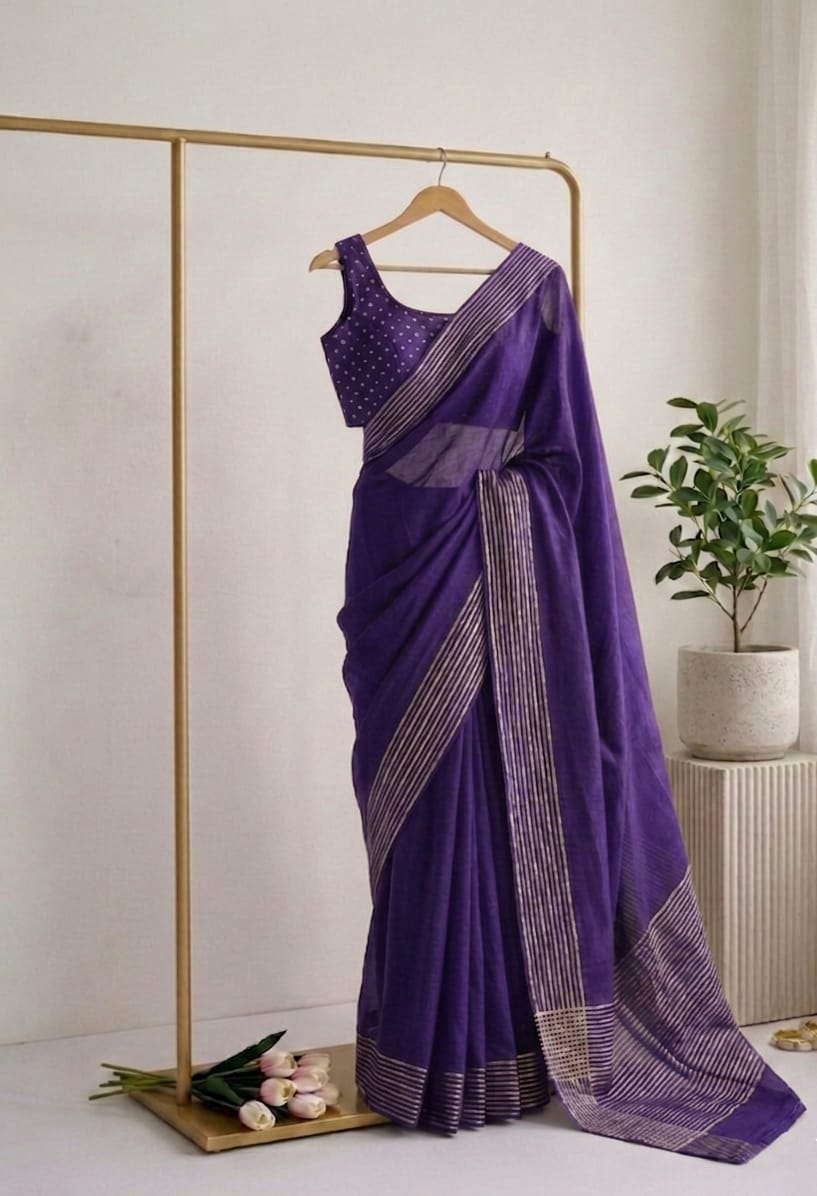 Purple saree with a gold hanger on a white background