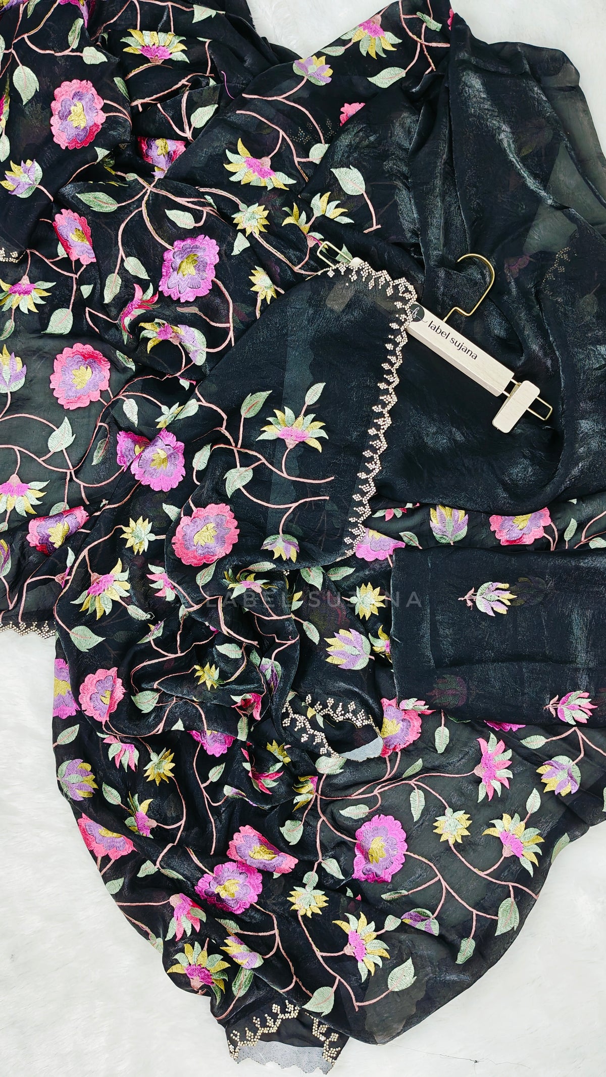 A black embroidery saree with matching blouse 
