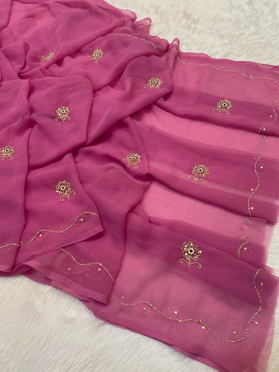 Pink saree with gold embroidery on a background