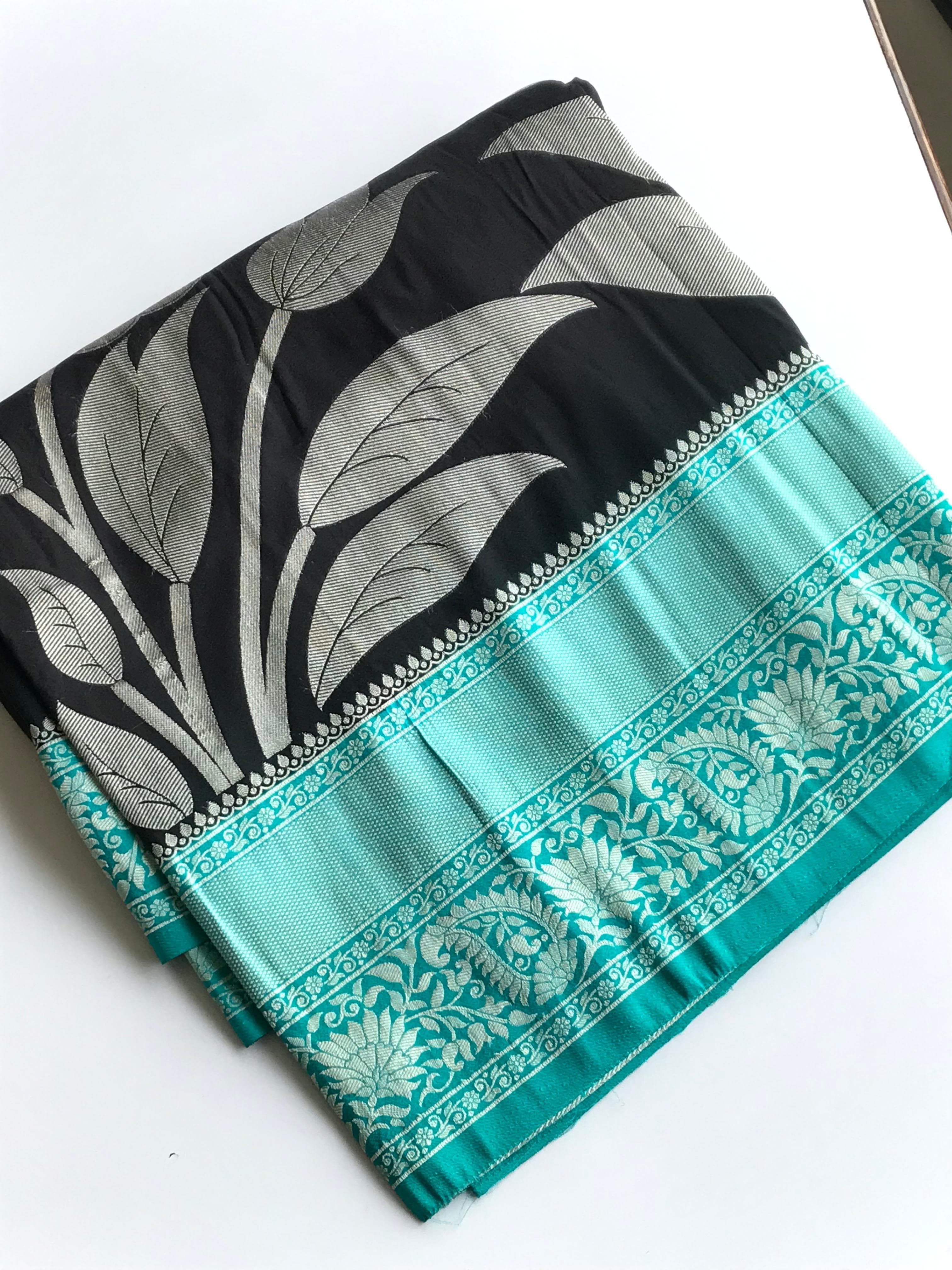 black saree with floral patterns 