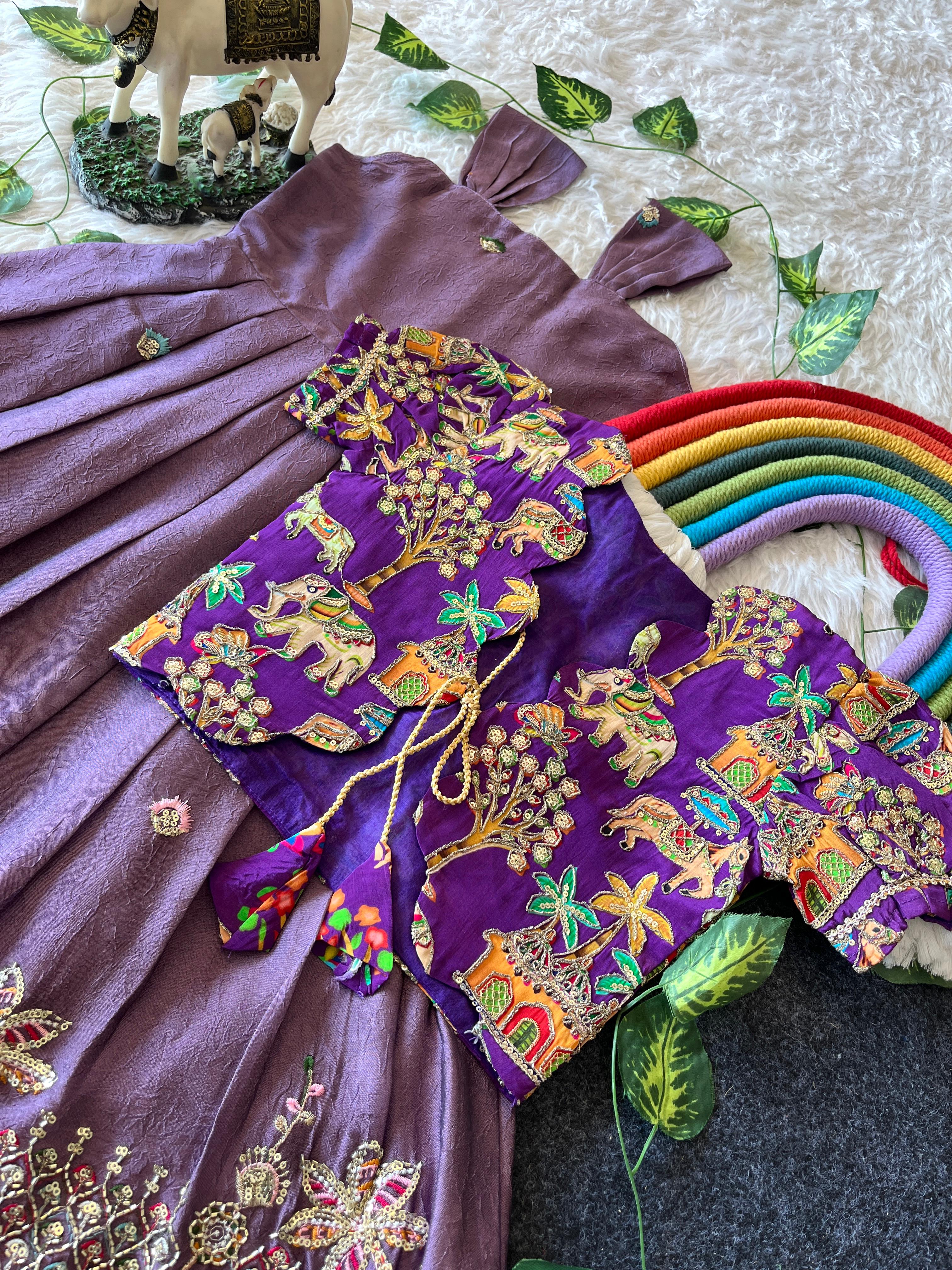 Lavender embroidered fabric with colorful patterns on a textured surface