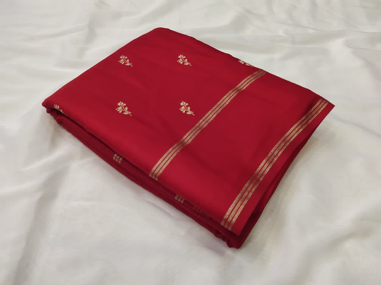 red fabric with floral patterns 