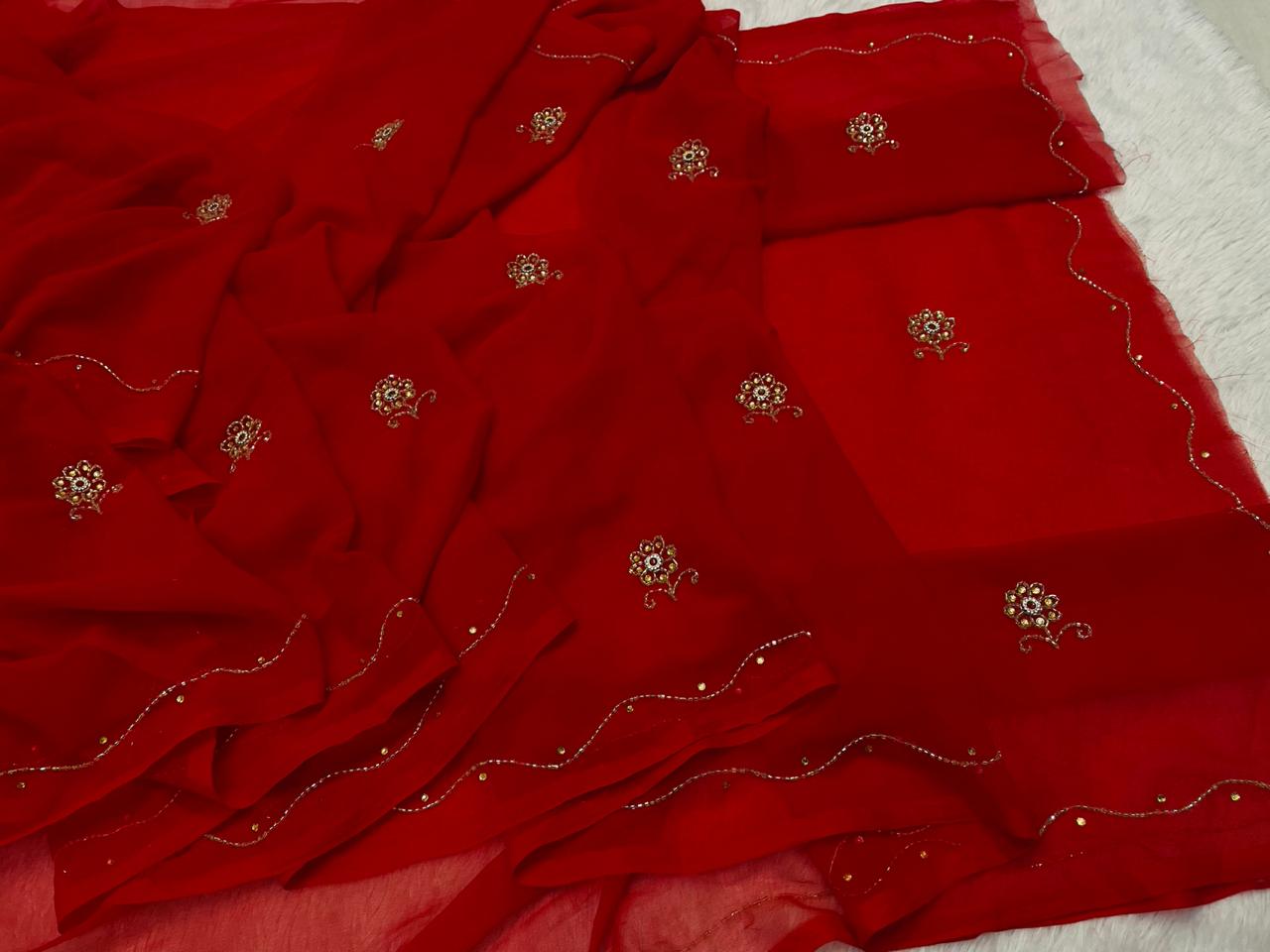 Red fabric with floral embroidery on a background