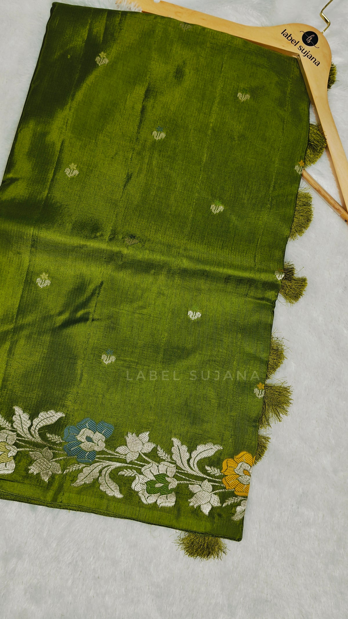 An olive green silk saree
