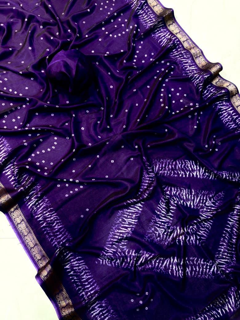 Purple fabric with sequin details and a gold border