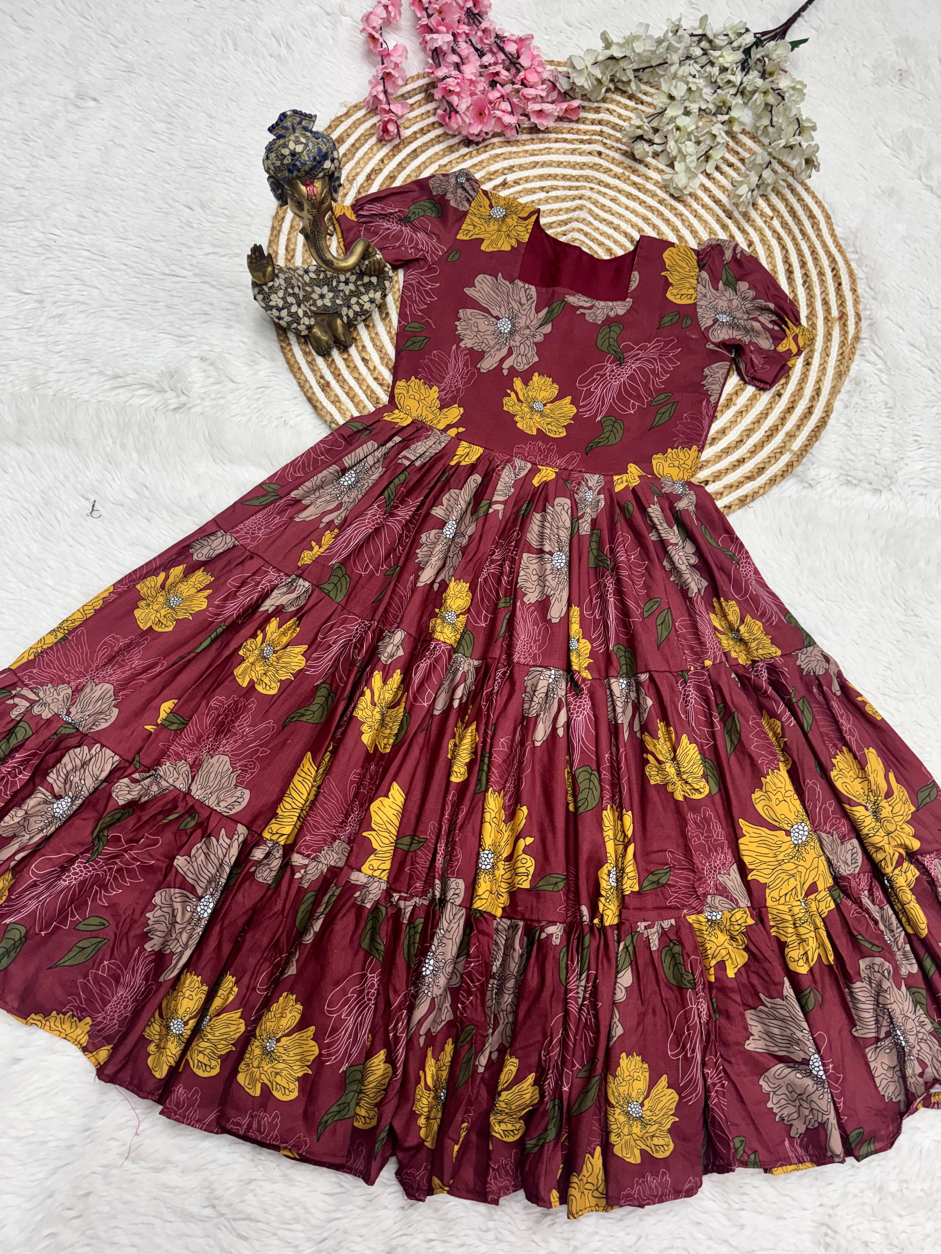 Maroon floral dress with flowers on a textured white background