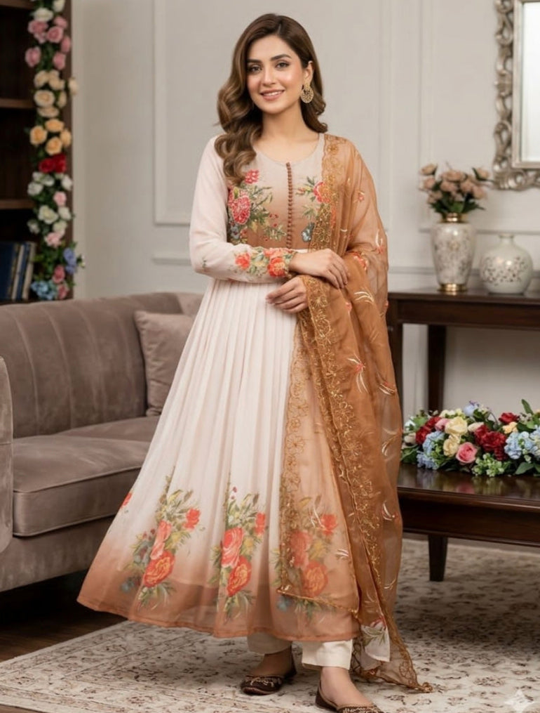 Woman in a white and brown traditional outfit with floral patterns in a decorated room.