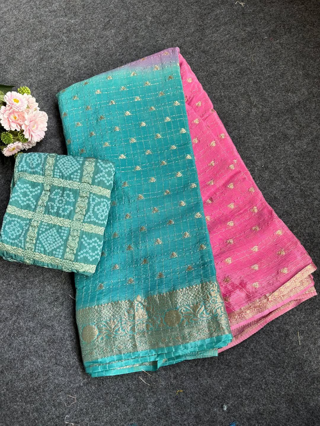 Sky blue saree on a dark surface.