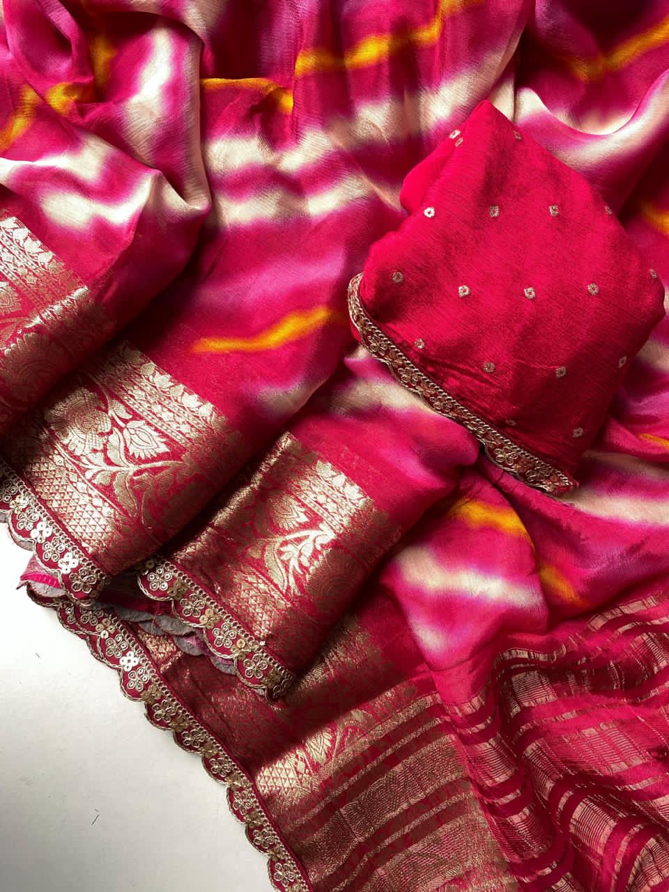  pink saree with intricate patterns on a white background