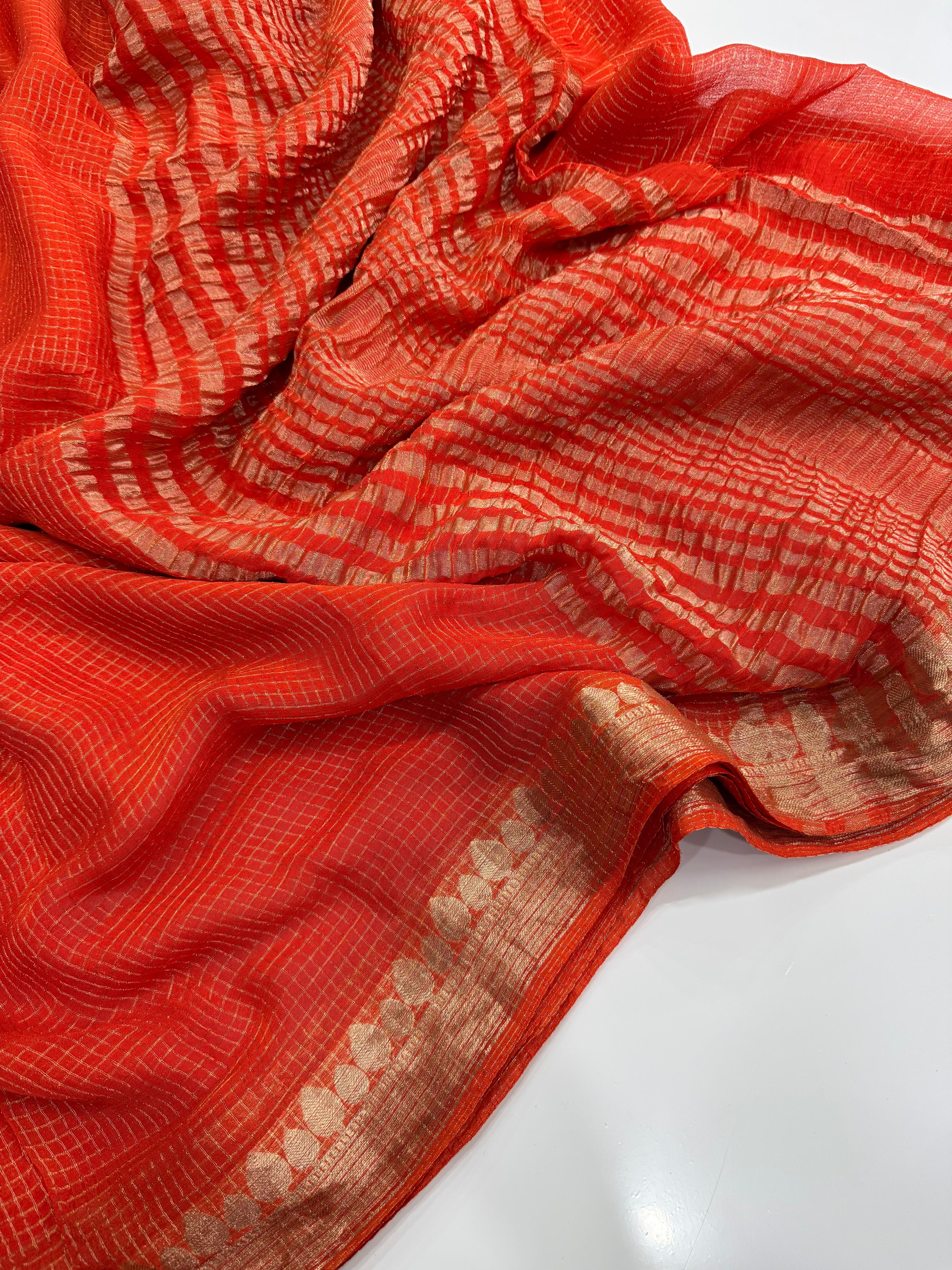 Orange fabric with white patterns on a white background