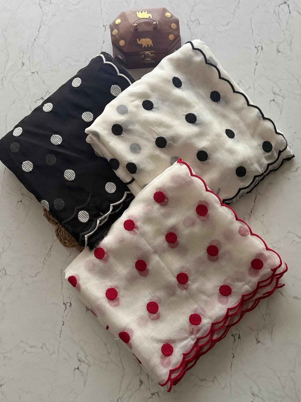 White with black dots, black with white dots, white with pink dots