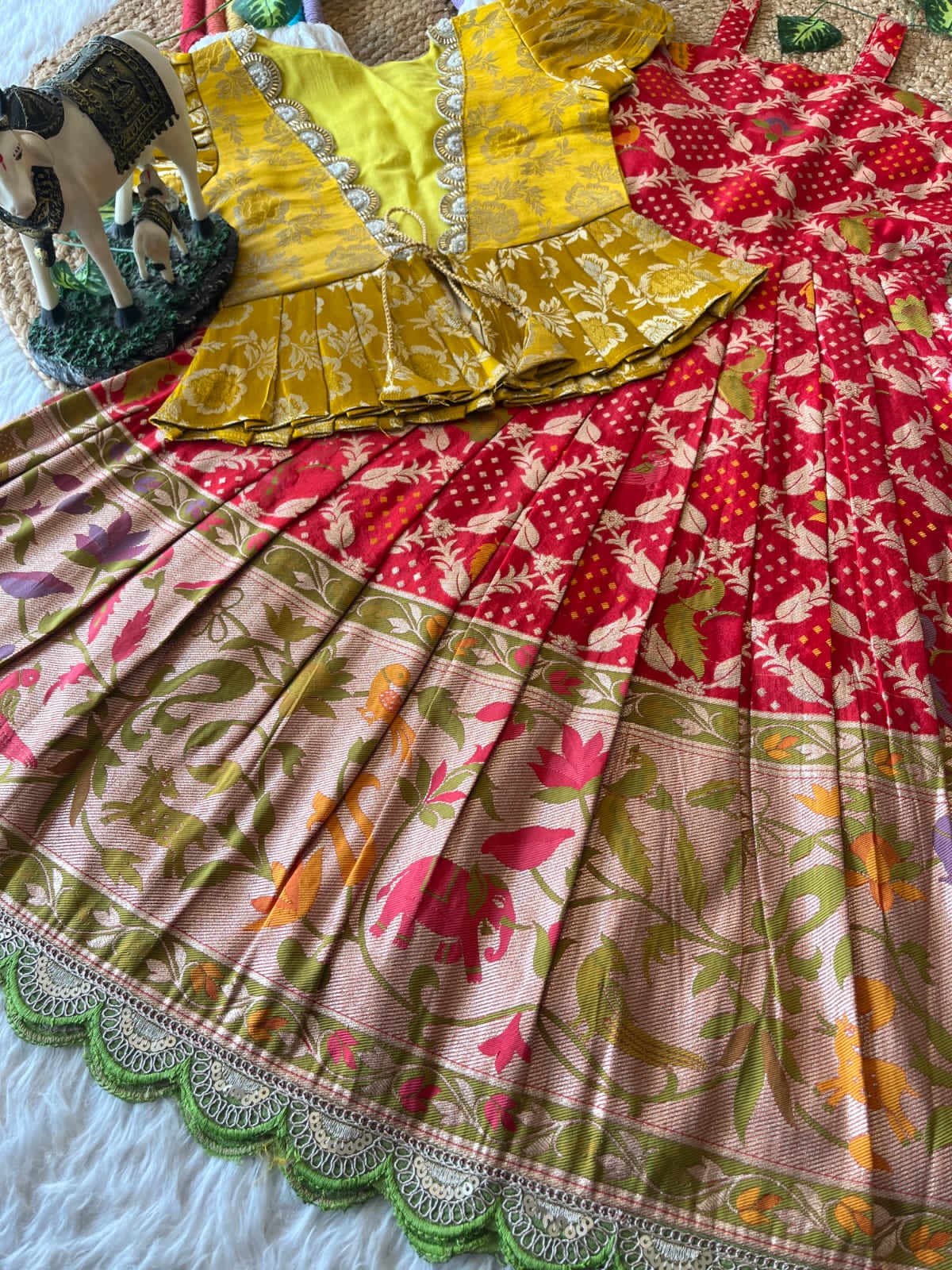 Colorful red fabric with various patterns and colors