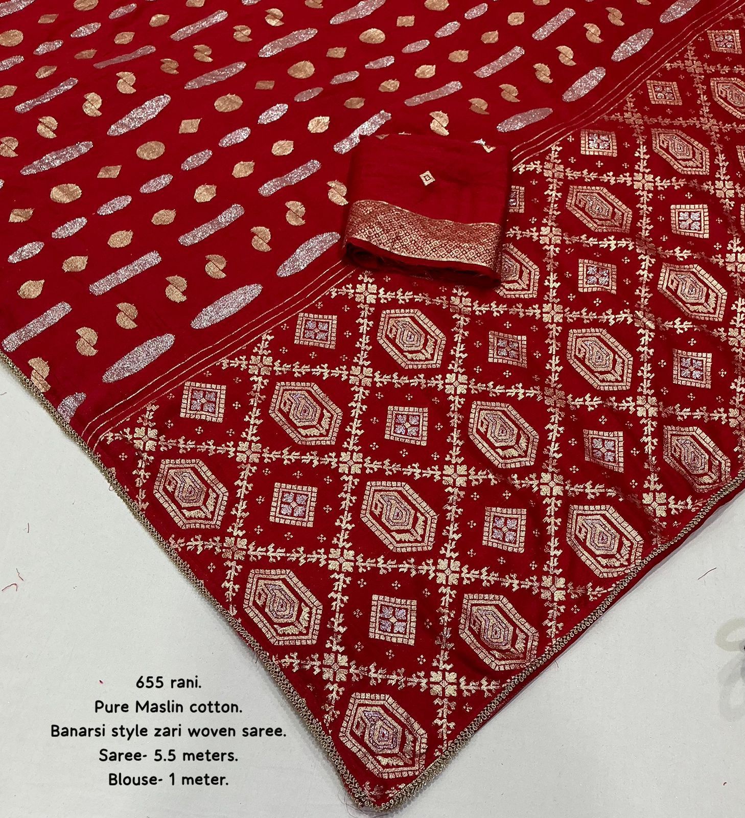 Red saree with white patterns on a white background