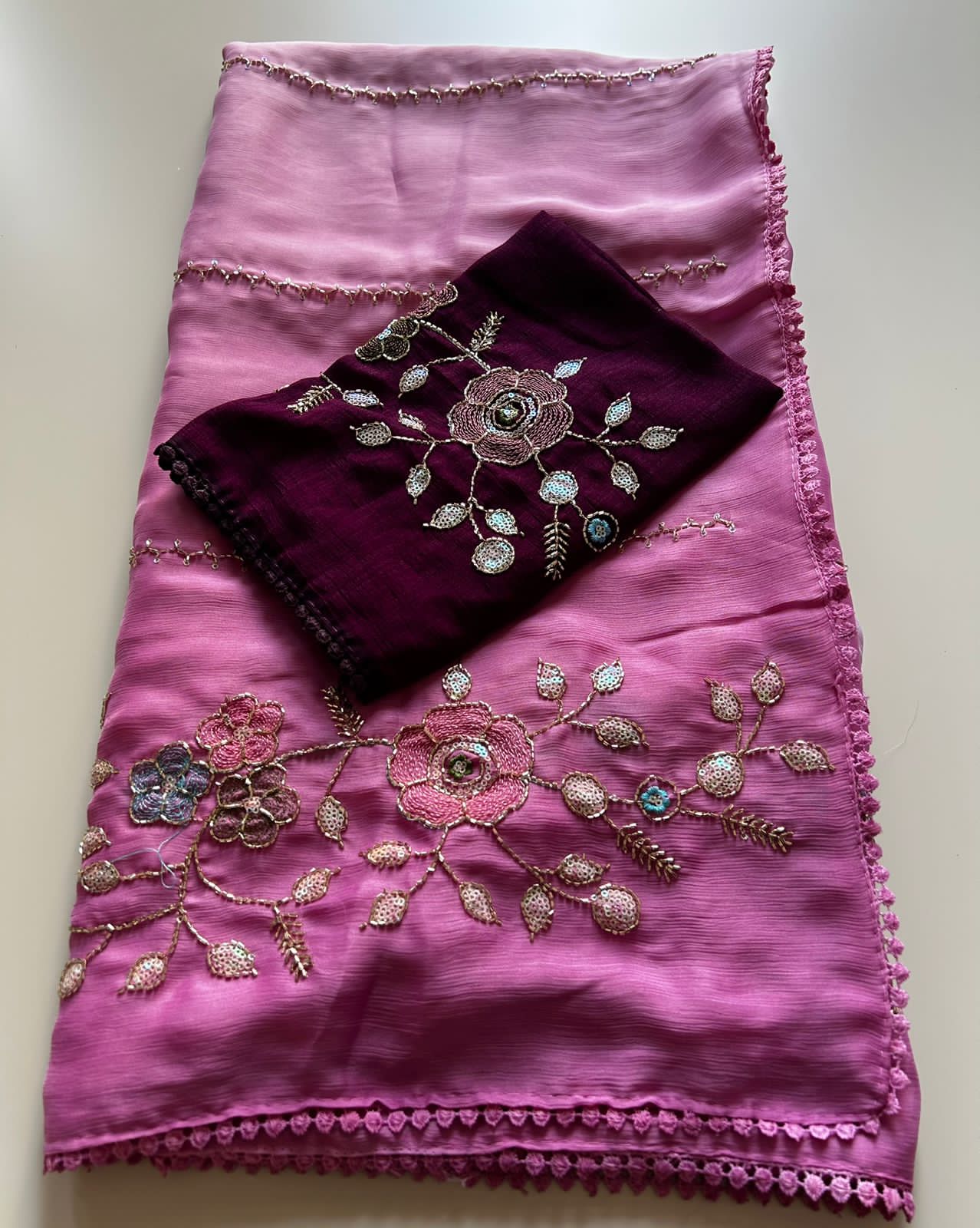 Baby Pink fabric with floral embroidery on a white background