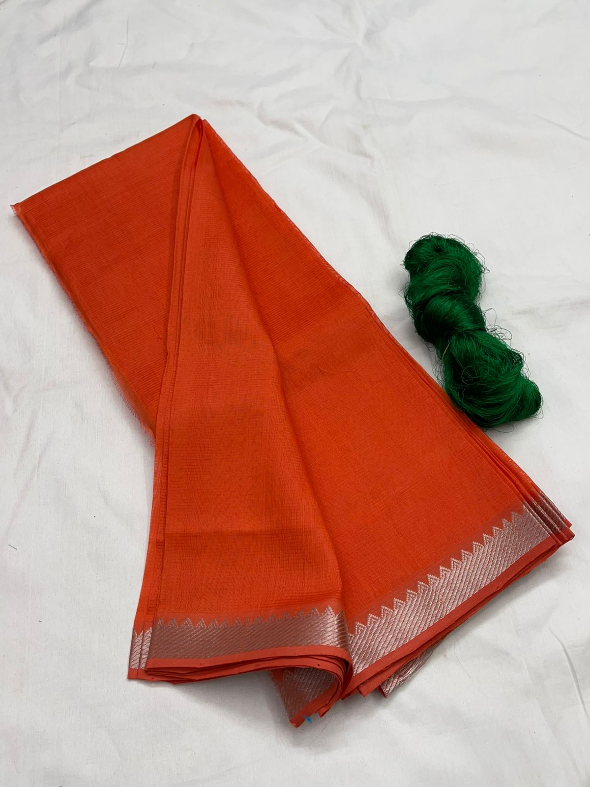 An orange Mangalagiri Handloom pattu saree