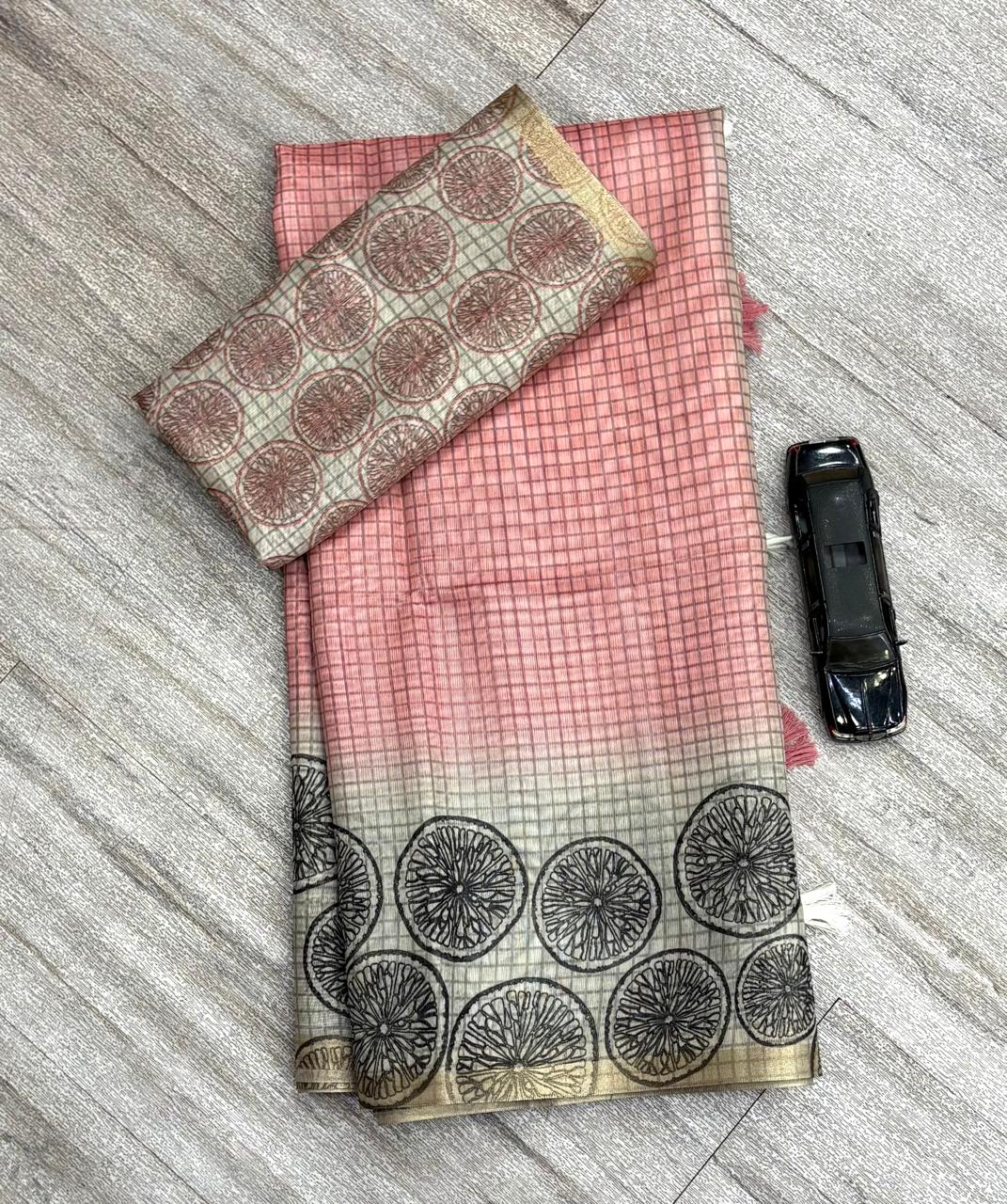 Peach Saree with geometric pattern on a textured surface