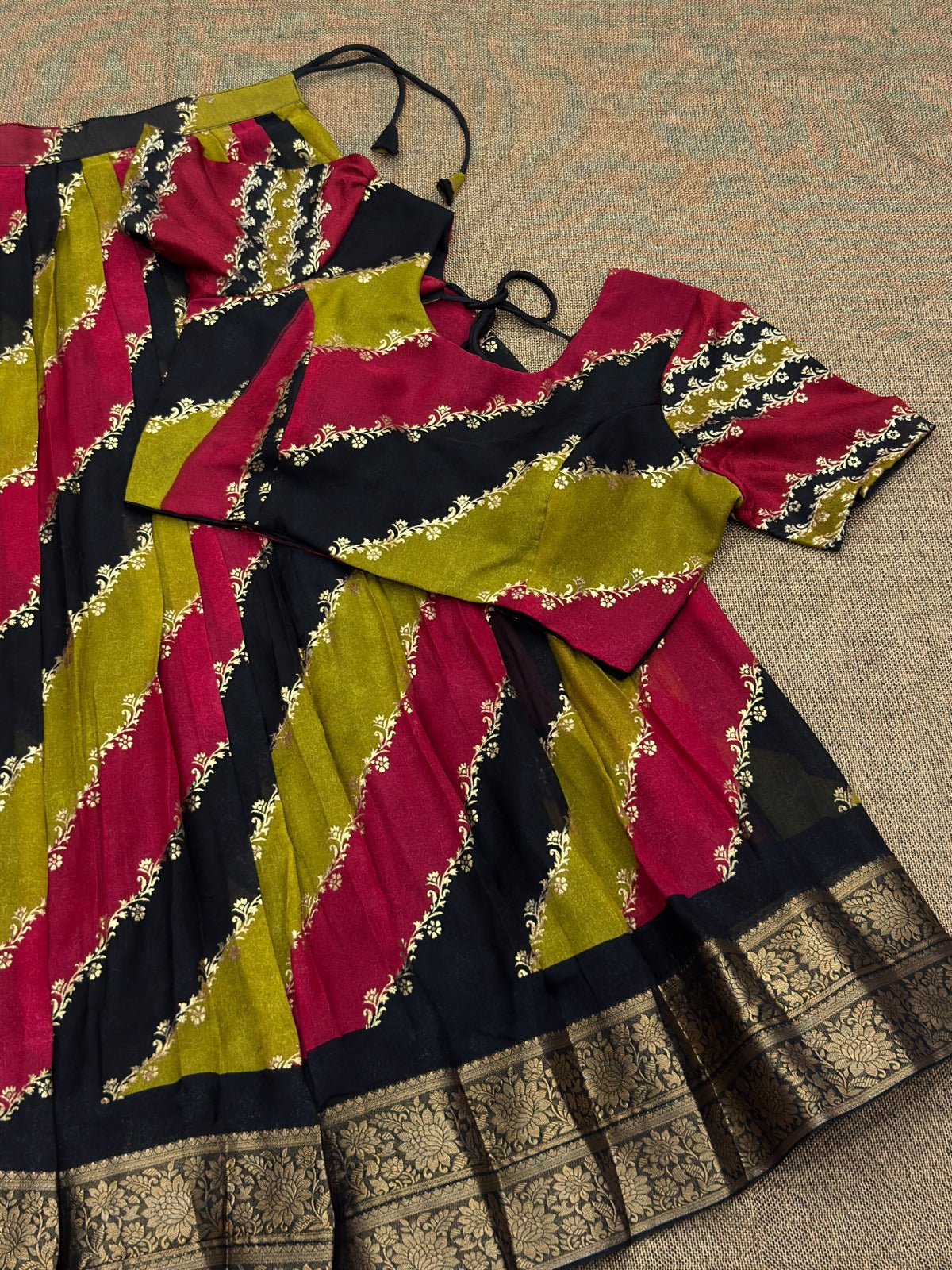 Multicolor traditional outfit with  patterns on a textured surface