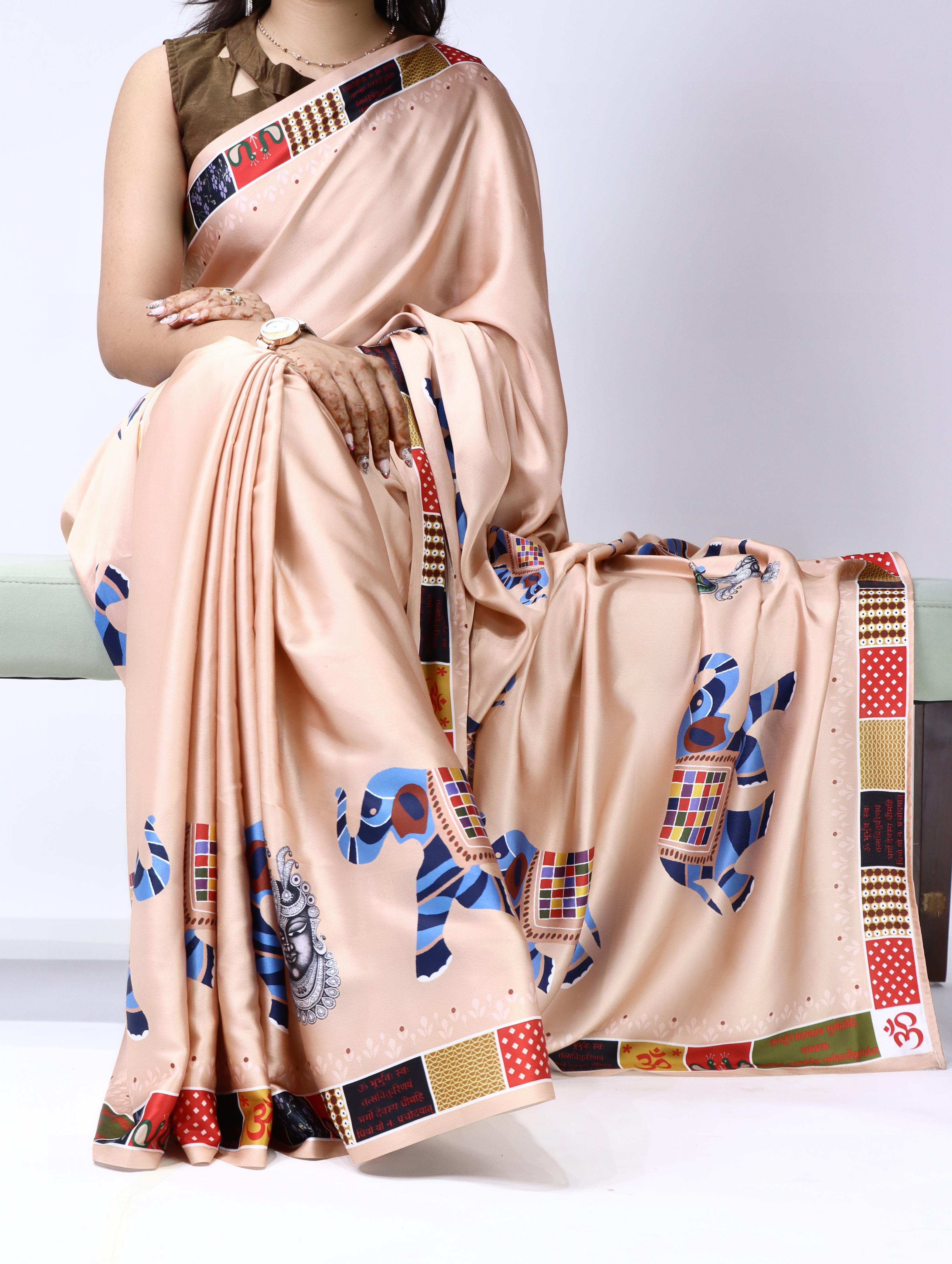 Peach saree with colorful patterns draped over a person on a white background
