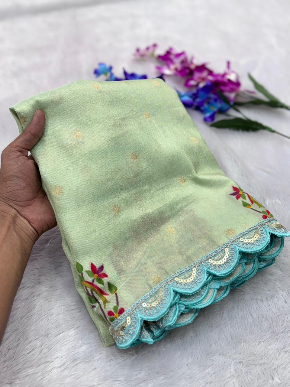 Light green saree with floral patterns 