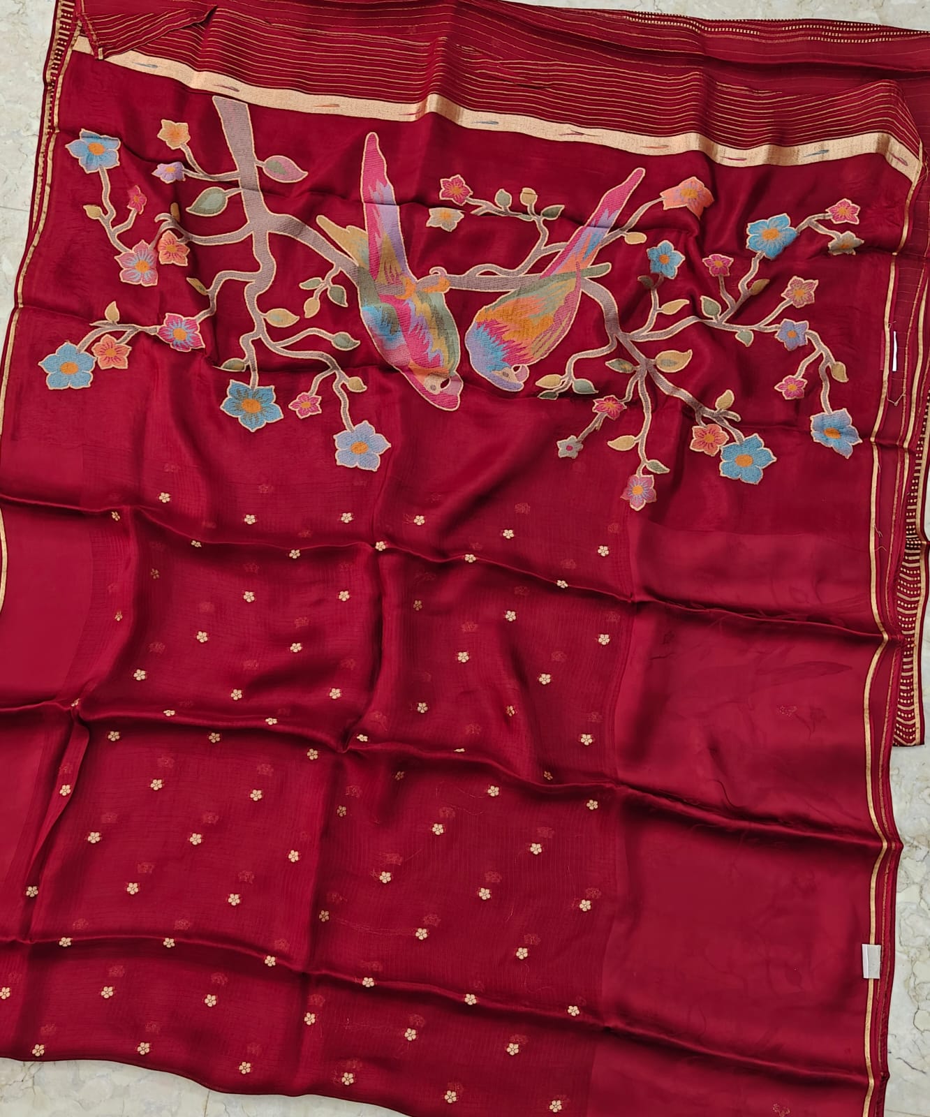 Pink saree with floral and bird patterns 