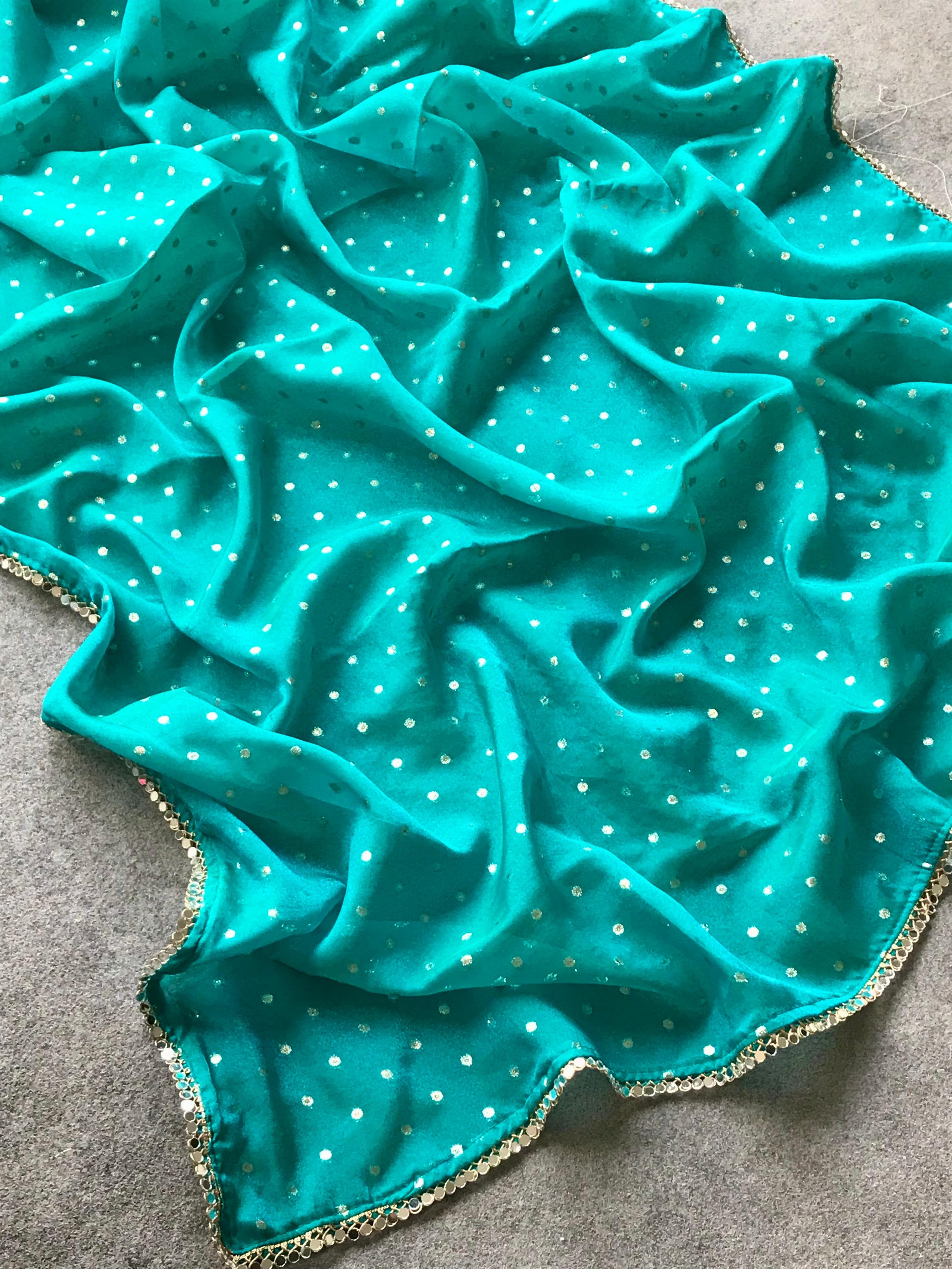 Sky blue fabric with white polka dots