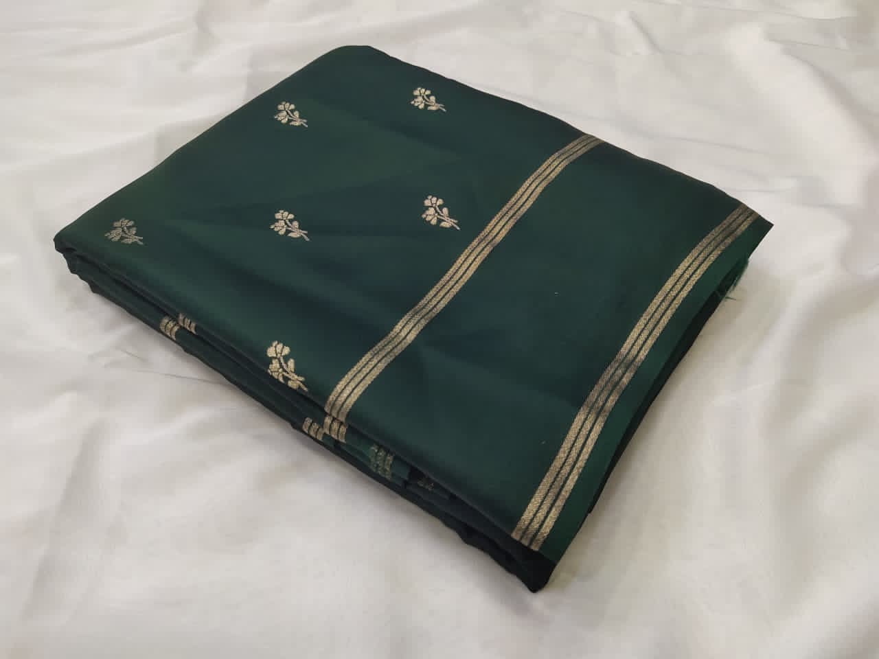Dark Green fabric with floral embroidery patterns 