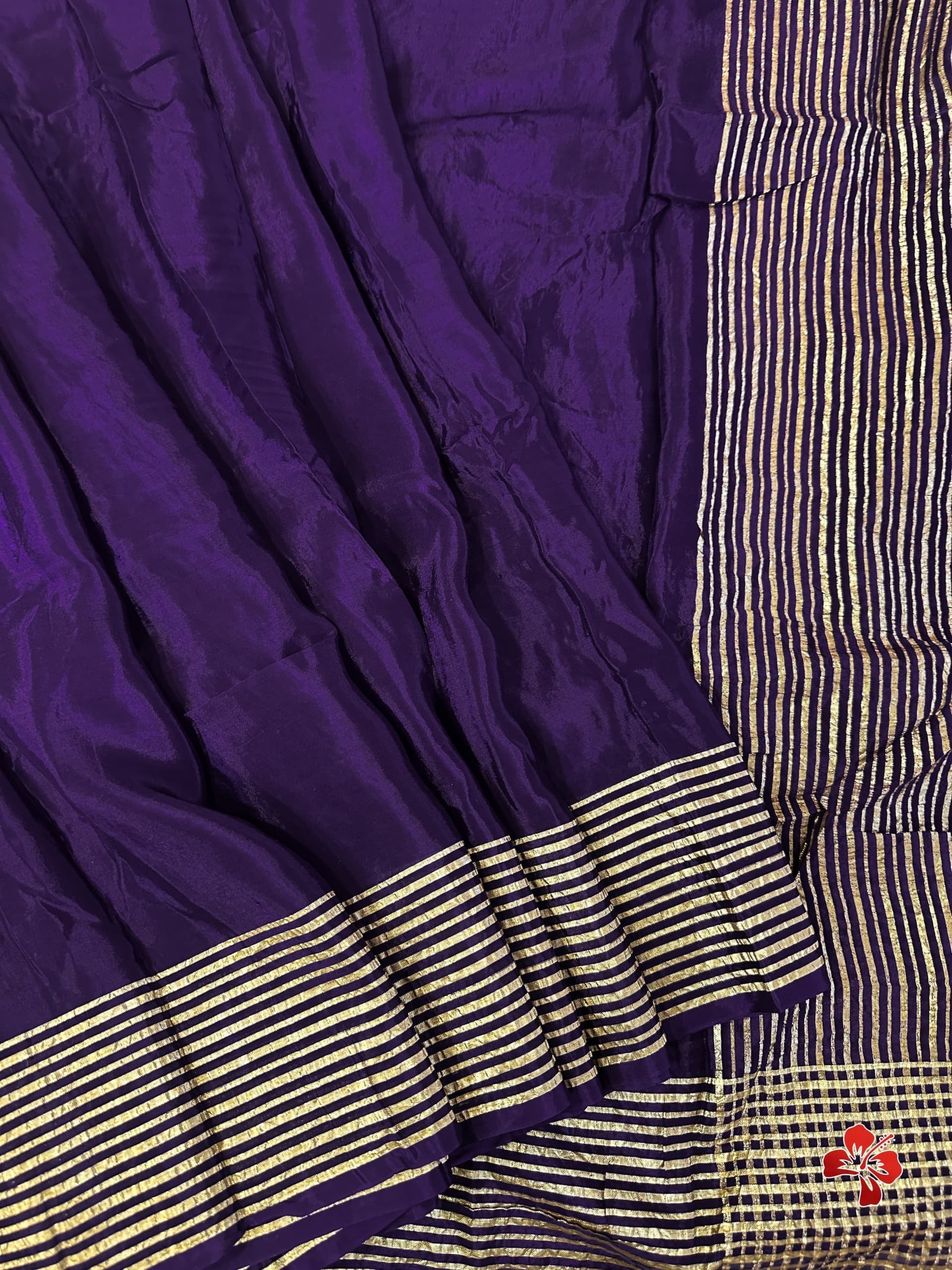 Purple fabric with gold striped border