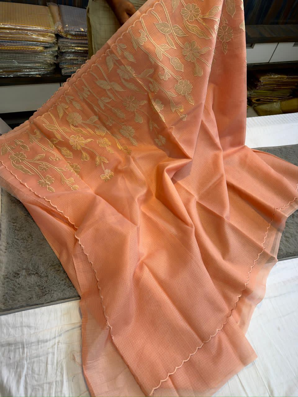 Orange saree with floral patterns 