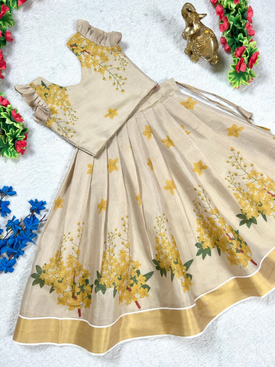 Beige lehanga with gold floral patterns 