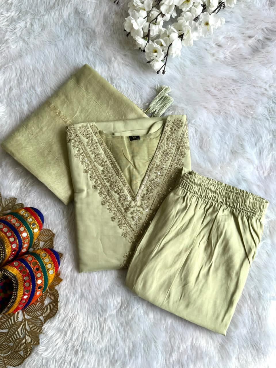 Light green outfit with embroidered details