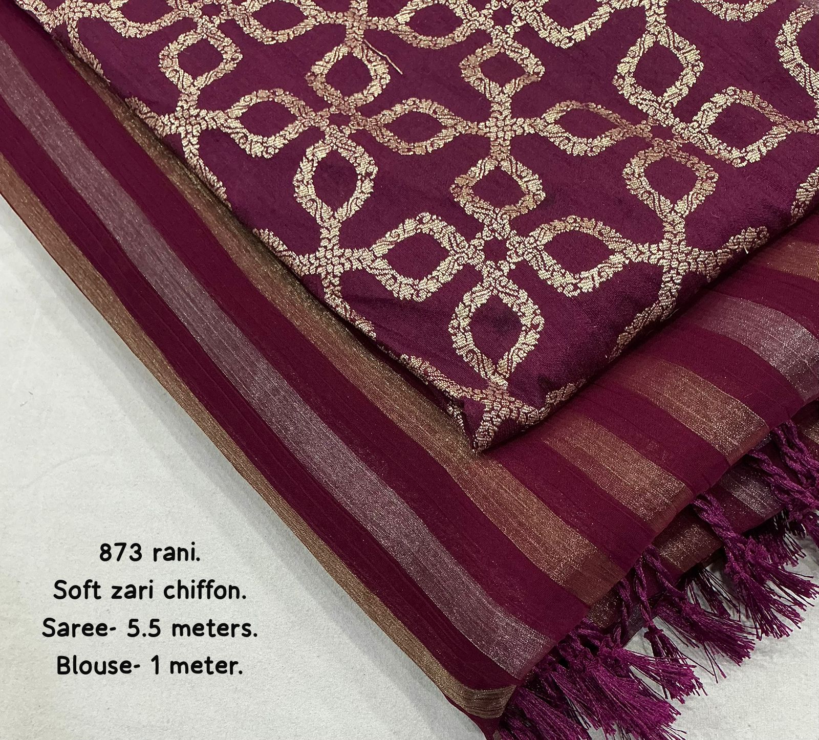 Wine saree with gold patterns on a white background