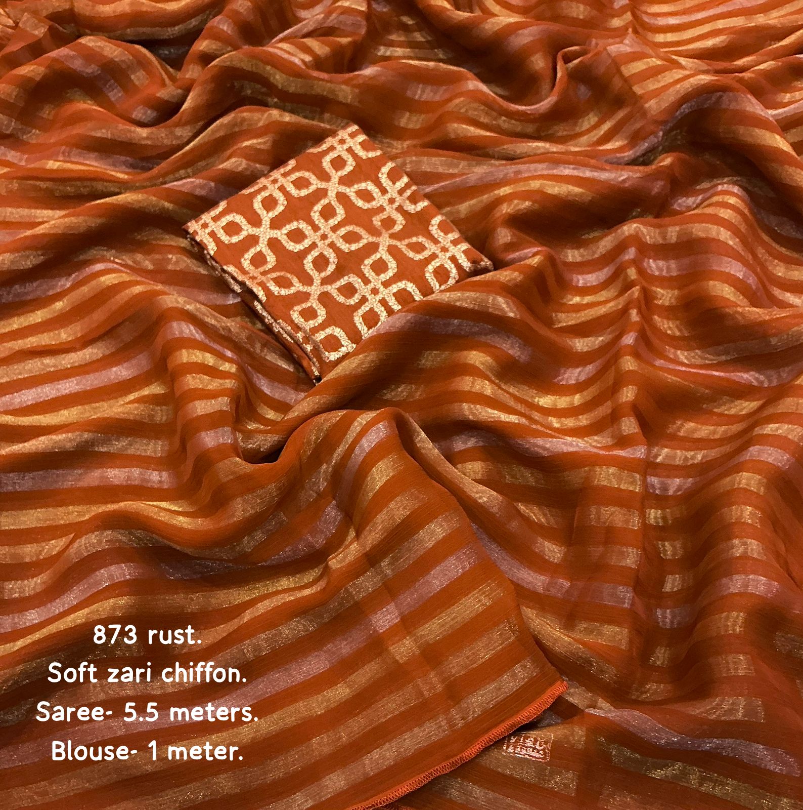 Brown saree with zari patterns and text detailing fabric details.