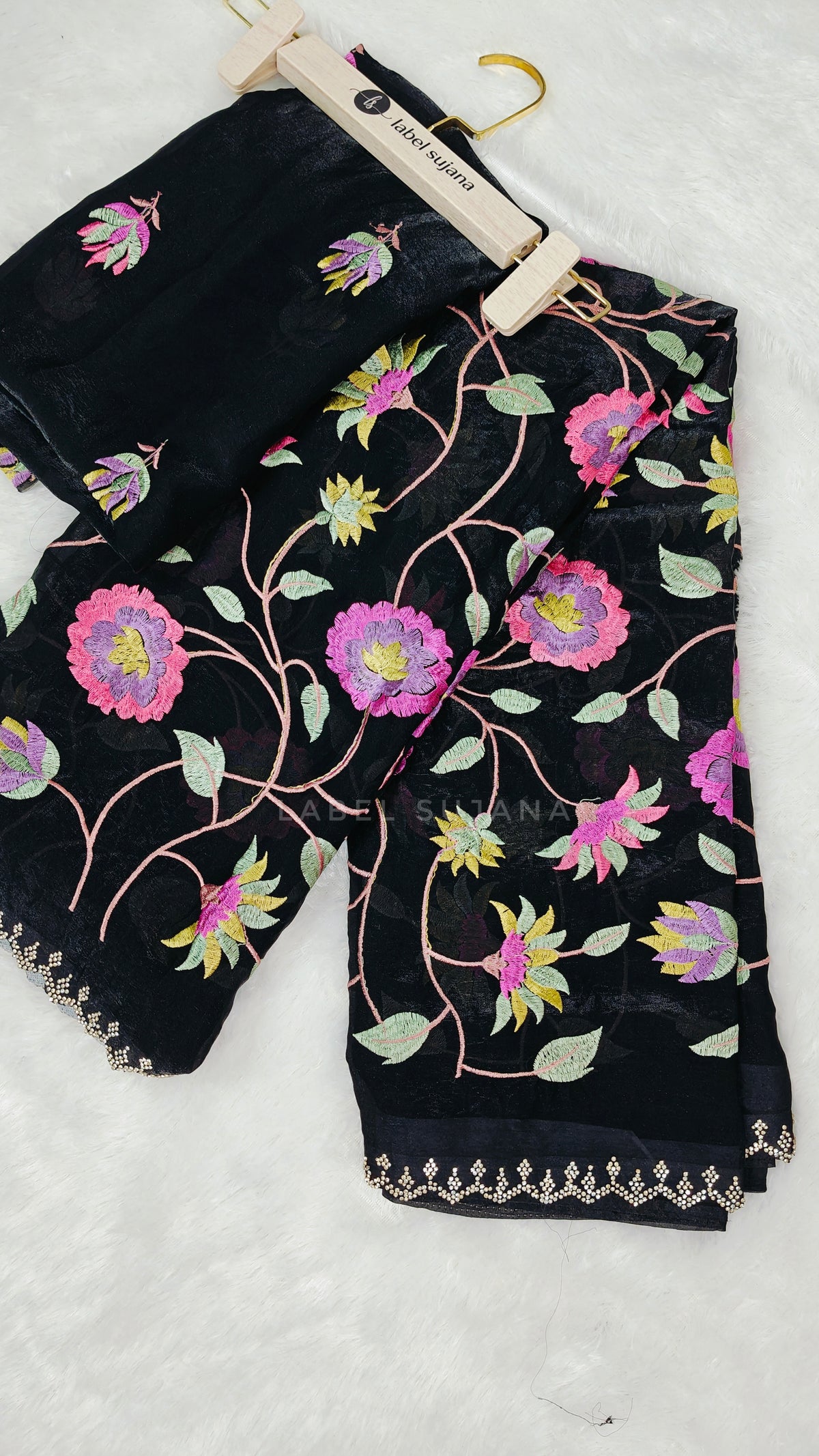 A black embroidery saree with matching blouse