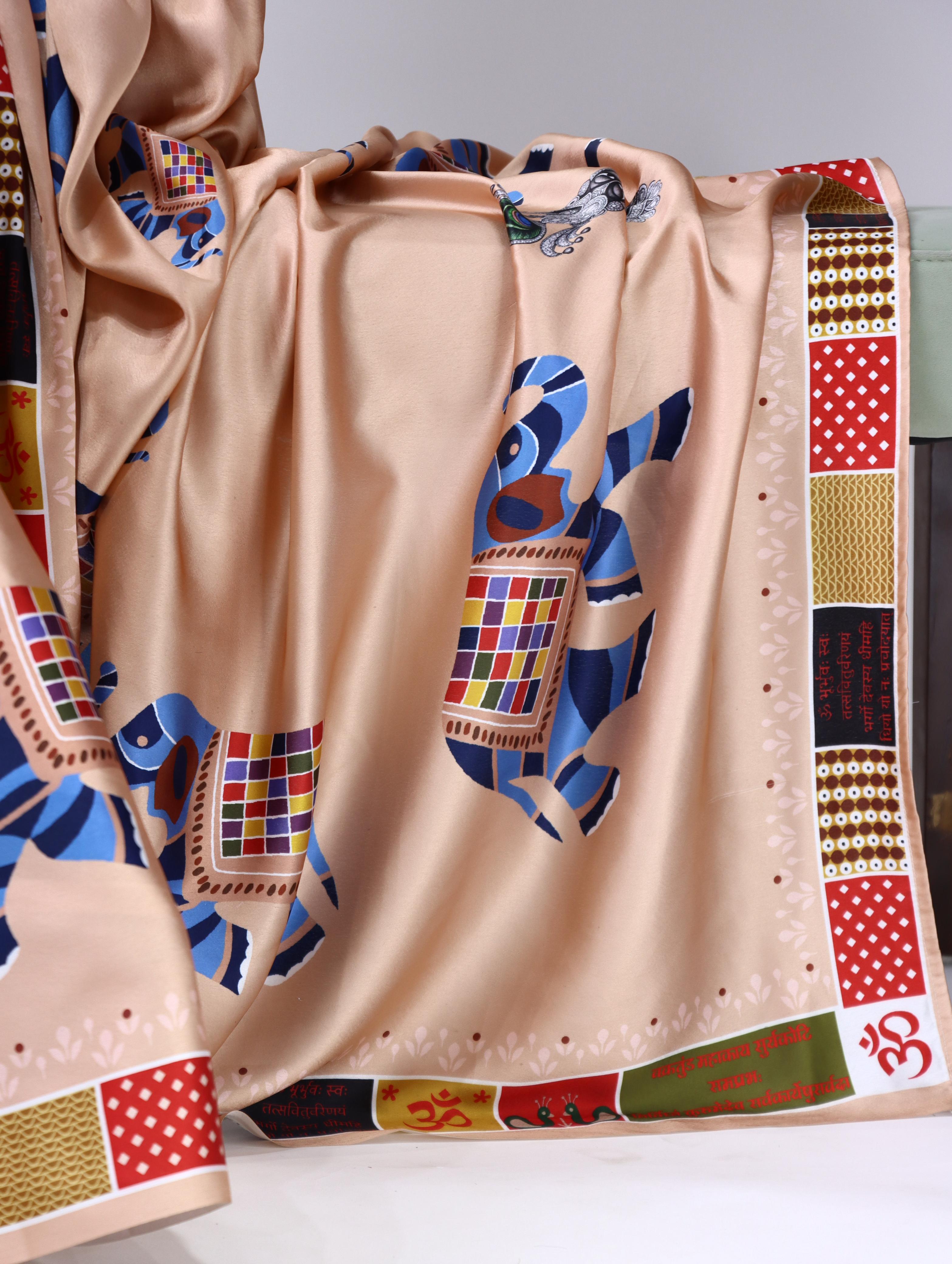 Peach saree with colorful elephant patterns on a white surface