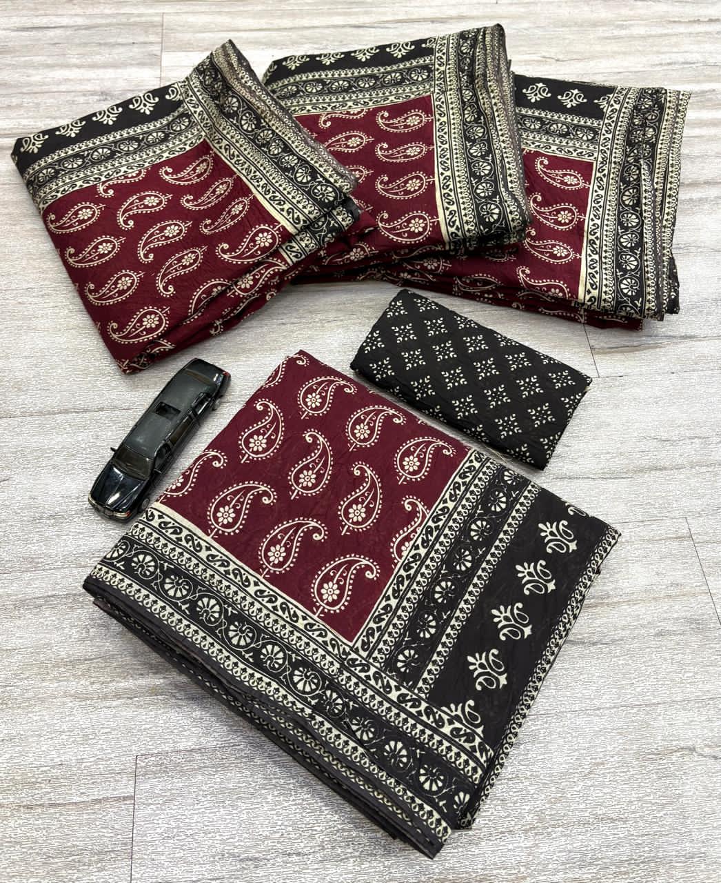 Maroon fabric with floral patterns 