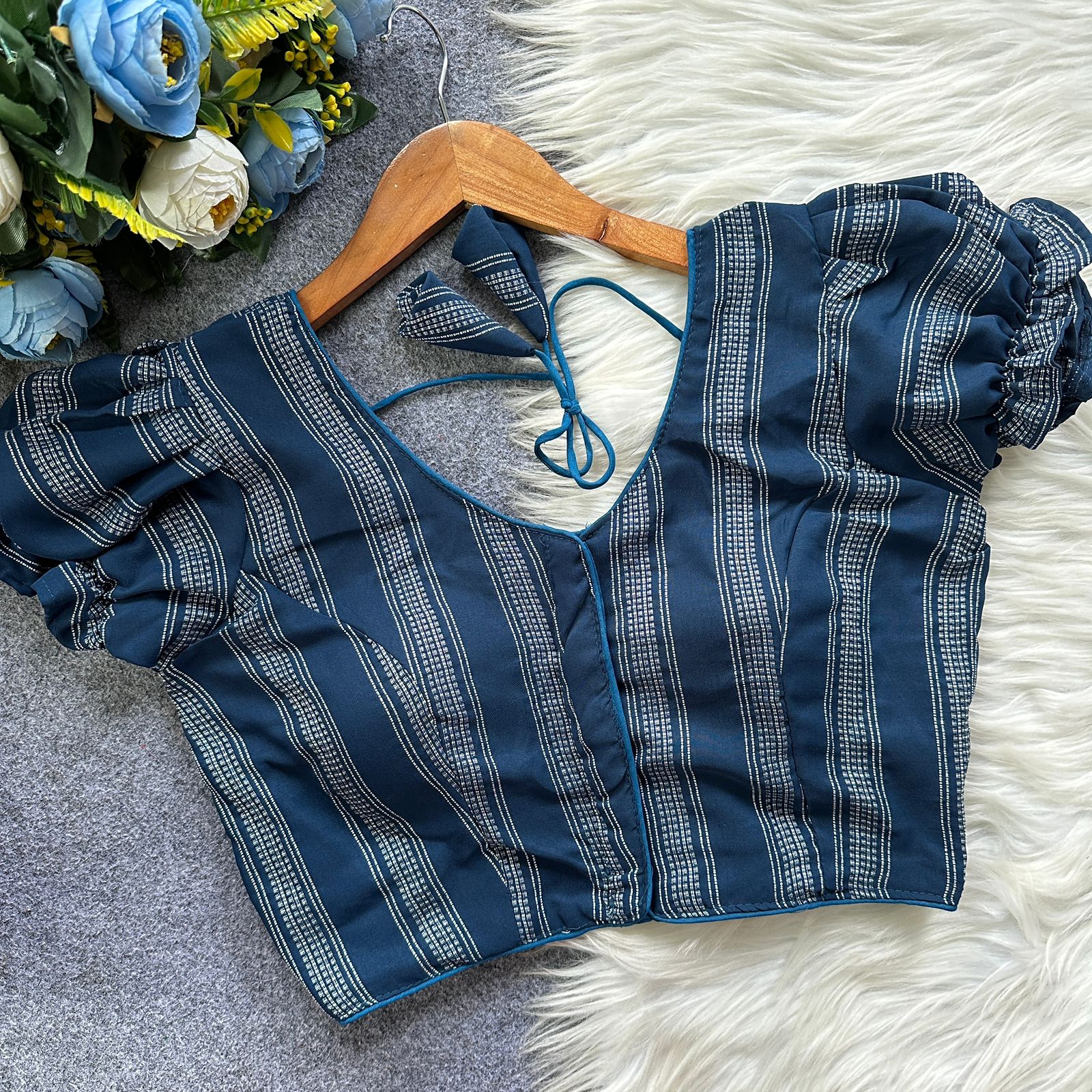  Blue blouse with floral patterns 
