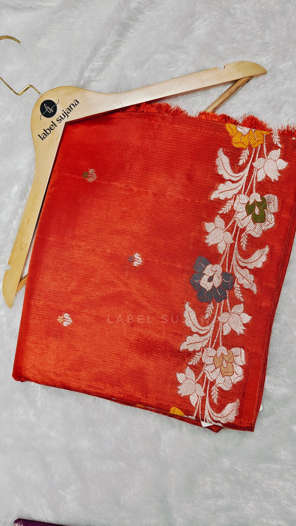 A Rust orange silk saree